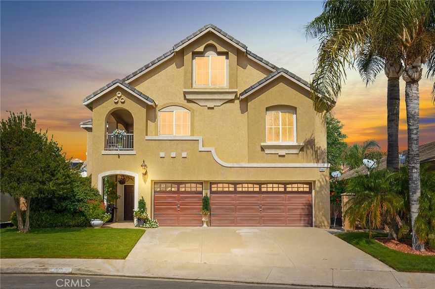 Welcome to this beautifully maintained 4-bedroom, 4-bathroom home with a 3-car garage, tucked away at the end of a quiet cul-de-sac in one of Murrieta’s most peaceful neighborhoods. Lovingly cared for by the original owners, this home blends timeless craftsmanship with thoughtful updates and family-focused comfort. The open living room showcases a stunning two-story Venetian plaster accent wall, tall windows framed with custom woodwork, and a breathtaking $40,000 custom-built second-floor library visible from below. The spacious kitchen features custom cabinetry, granite counters, stainless steel appliances, a Brizo faucet, pull-out spice racks on both sides of the oven and microwave, pull-out storage on both sides of the kitchen sink, a double trash pullout, under-cabinet lighting, and a lighted glass display cabinet. The dining room offers a coffered ceiling and crystal chandelier, while the expansive family room provides flexible space for entertaining or relaxing. Brand new hardwood flooring was installed downstairs in 2023, adding warmth and elegance throughout the main level. The main floor includes a full bathroom and an area that could easily be converted into a bedroom, ideal for guests or multi-generational living. Upstairs, the impressive primary suite spans the entire width of the home, offering space for a sitting area, gym, or office, and features a generous ensuite with dual sinks, a large soaking tub, and a spacious walk-in closet. The large bonus room includes access to a private balcony perfect for morning coffee or evening sunsets, while the third floor serves as a versatile retreat for creativity, recreation, or movie nights with a large projection wall. Enjoy the private enclosed flagstone courtyard with a split-faced stone wall, built-in fountain, timer-controlled lighting, and custom wrought-iron gates at both the courtyard and side entry. The backyard offers a gas BBQ hookup, mature trees, and lush landscaping for a peaceful outdoor retreat. Each floor has its own dedicated A/C unit for comfort and efficiency. Additional highlights include updated plumbing and electrical with 20-amp outlets in the garage and exterior, a very low-payment solar lease, plenty of storage throughout, and no HOA. Close to parks, top schools, and Temecula Wine Country, this home perfectly balances elegance, warmth, and everyday family living.