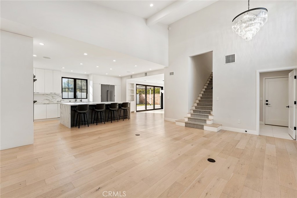 Exquisite Renovated Home in a Serene Tarzana Cul-de-Sac. Discover modern elegance and comfort in this beautifully renovated 4-bedroom, 2.5-bathroom residence, nestled in a tranquil cul-de-sac in Tarzana. Renovated to perfection in 2020, this home seamlessly blends contemporary design with luxurious finishes. High ceilings and pristine white oak engineered hardwood floors create an open and inviting atmosphere throughout the home. The open-concept layout effortlessly connects the living, dining, and family rooms, perfect for both entertaining and everyday living. The Gourmet Chef’s Kitchen customized to perfection boasts chef-grade integrated appliances, a large island with stunning waterfall edges, and ample cabinetry. Whether you're preparing a casual meal or hosting a dinner party, this kitchen is a culinary dream. Primary Suite Retreat located upstairs offers a peaceful sanctuary with abundant natural light. The luxurious primary bathroom features dual sinks, a walking shower equipped with multiple shower heads, and a freestanding bathtub, providing a spa-like experience. The spacious secondary bedrooms are designed for comfort and versatility, sharing a well-appointed second bathroom with double sinks and a shower/bath combo, accommodating family and guests with ease. A Home Office with a secret door discreetly leads to a private office downstairs, offering a quiet and secluded workspace away from the main living areas. Accordion doors open to a covered patio, seamlessly extending your living space outdoors. The great backyard provides a picturesque setting for gatherings, relaxation, and enjoying the beautiful weather. Enjoy the convenience of a fully enabled smart home, offering control over lights, garage doors, locks, and window blinds with ease. Immerse yourself in a whole-home integrated audio speaker system, perfect for entertainment and relaxation. This stunning Tarzana home offers the perfect blend of luxury, functionality, and style. Whether you're entertaining in the open-concept living spaces, enjoying the tranquility of the primary suite, or working from the private office, this residence caters to every aspect of modern living. Don’t miss the opportunity to make this exceptional house your new home! Contact us today to schedule a private tour.