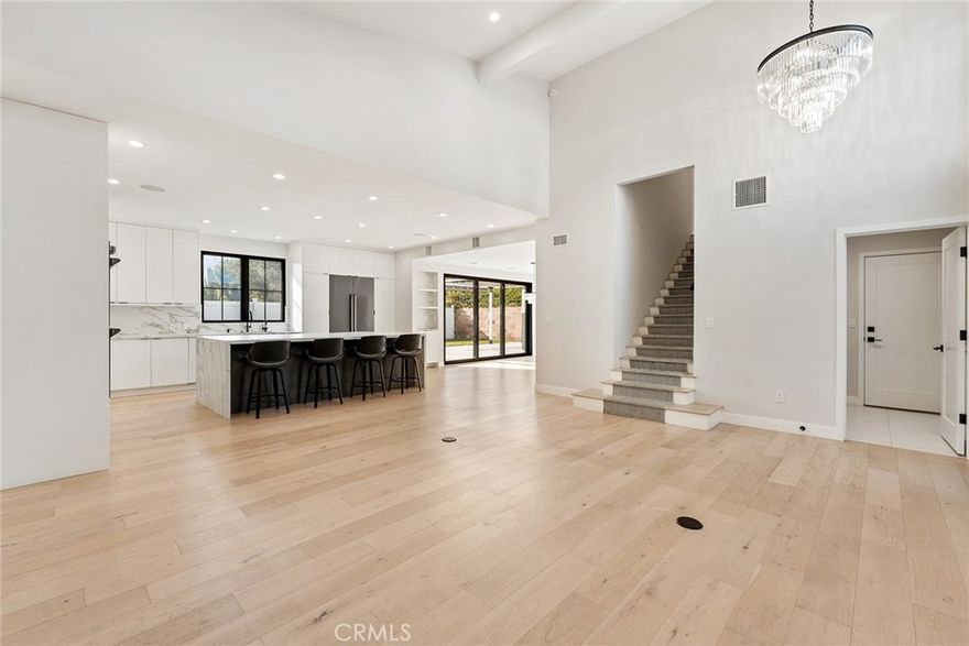 Exquisite Renovated Home in a Serene Tarzana Cul-de-Sac. Discover modern elegance and comfort in this beautifully renovated 4-bedroom, 2.5-bathroom residence, nestled in a tranquil cul-de-sac in Tarzana. Renovated to perfection in 2020, this home seamlessly blends contemporary design with luxurious finishes. High ceilings and pristine white oak engineered hardwood floors create an open and inviting atmosphere throughout the home. The open-concept layout effortlessly connects the living, dining, and family rooms, perfect for both entertaining and everyday living. The Gourmet Chef’s Kitchen customized to perfection boasts chef-grade integrated appliances, a large island with stunning waterfall edges, and ample cabinetry. Whether you're preparing a casual meal or hosting a dinner party, this kitchen is a culinary dream. Primary Suite Retreat located upstairs offers a peaceful sanctuary with abundant natural light. The luxurious primary bathroom features dual sinks, a walking shower equipped with multiple shower heads, and a freestanding bathtub, providing a spa-like experience. The spacious secondary bedrooms are designed for comfort and versatility, sharing a well-appointed second bathroom with double sinks and a shower/bath combo, accommodating family and guests with ease. A Home Office with a secret door discreetly leads to a private office downstairs, offering a quiet and secluded workspace away from the main living areas. Accordion doors open to a covered patio, seamlessly extending your living space outdoors. The great backyard provides a picturesque setting for gatherings, relaxation, and enjoying the beautiful weather. Enjoy the convenience of a fully enabled smart home, offering control over lights, garage doors, locks, and window blinds with ease. Immerse yourself in a whole-home integrated audio speaker system, perfect for entertainment and relaxation. This stunning Tarzana home offers the perfect blend of luxury, functionality, and style. Whether you're entertaining in the open-concept living spaces, enjoying the tranquility of the primary suite, or working from the private office, this residence caters to every aspect of modern living. Don’t miss the opportunity to make this exceptional house your new home! Contact us today to schedule a private tour.