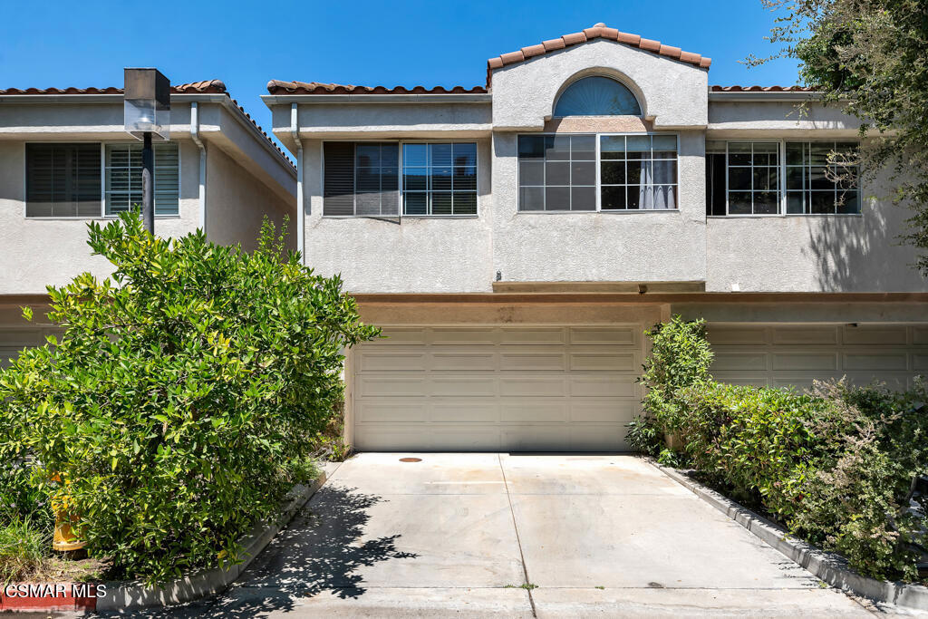 Welcome to this beautifully updated 3-bedroom, 2.5-bath home, offering over 1,660 square feet of stylish living space in a prime Thousand Oaks location--just moments from shopping, dining, top-rated schools, and everyday conveniences. Enjoy direct access from the attached 2-car garage into this bright and light-filled home featuring soaring ceilings and a cozy fireplace in the spacious main living area. The first level also includes a remodeled kitchen with modern finishes, a convenient half bath, inside laundry room, and access to the private backyard Flagstone patio--perfect for relaxing or entertaining on warm California evenings. Upstairs, the spacious primary suite offers a peaceful retreat with views of majestic oak trees, a balcony and en-suite remodeled bath. Two generously sized secondary bedrooms are completed with a beautifully updated hall bathroom. Additional highlights include fully remodeled baths, recessed lighting, updated flooring, a resurfaced balcony, and a newer HVAC system for year-round comfort. Ideally located just steps from the community pool, spa, and a charming woodsy play area--or wander to the nearby Gardens of the World botanical gardens. Move-in ready and impeccably maintained, this thoughtfully renovated home is a rare opportunity in the heart of Thousand Oaks.