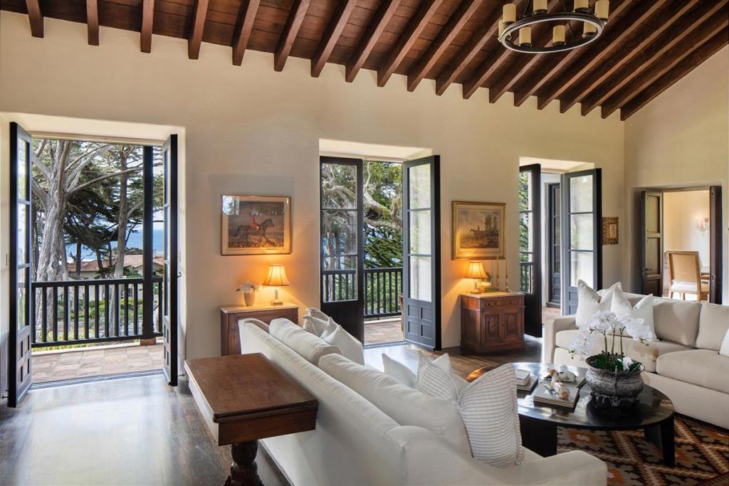 Capturing the essence of Pebble Beach, this 1920s estate offers the best combination of views, privacy, and proximity to The Lodge. Renovated in 2017, this 4 bedroom house boasts ocean views from the main living areas with vaulted ceilings, a classic wood burning fireplace, and authentic hardwood floors all over looking the ocean-facing deck. Just off the living area and deck, the intimate dining room looks to the Pacific and across the oak trees and grounds, setting the perfect scene to share long evenings with friends. The master bedroom, located on the main level, is surrounded by the serenity of native trees and lush gardens. A separate one bedroom guest house just off the main house is perfect for guests looking for a little more privacy. All this sited on a 2.3 acre corner lot along the famed 17 Mile Drive and just down the street from The Lodge.