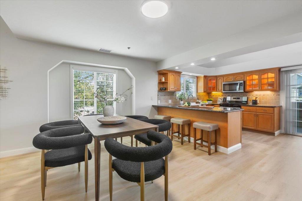Beautiful 3 Bedroom plus a versatile 4th room Townhome style Residence with 1840sf! Enjoy a bright, open-concept floorplan designed for modern living. Academic Excellence with Cupertino's Lincoln ES (8), Kennedy MS (8) & Monta Vista High (9). CLOSE TO IT ALL -1 block to Starbucks & restaurants, 7 blocks to schools, 6 blocks to De Anza College, 8 blocks to Whole Foods & more! Step inside to a stunning home where the spacious kitchen overlooks the dining area & flows effortlessly into the living room - perfect for entertaining or everyday living. TRUE CHEFS KITCHEN is a culinary dream, featuring shaker cabinetry, granite countertops, huge breakfast bar, under-cabinet lighting, & newer stainless steel appliances including a GAS STOVE. LUXURIOUS GRAND PRIMARY SUITE offers private access to a peaceful outdoor balcony, a walk-in closet, spa-inspired en-suite bath w/ a large vanity. 2 BEDROOMS ON GROUND LEVEL. The JUNIOR PRIMARY SUITE, tucked just off the family room, provides built-in desk space, generous closet storage, & privacy ideal for guests. Enjoy soaring vaulted ceilings, gleaming wood floors, & multiple outdoor spaces for relaxing or entertaining. Amazing VALLEY VIEWS! Private Garage! Central heating & A/C,front-loading washer+dryer & ENDLESS storage!
