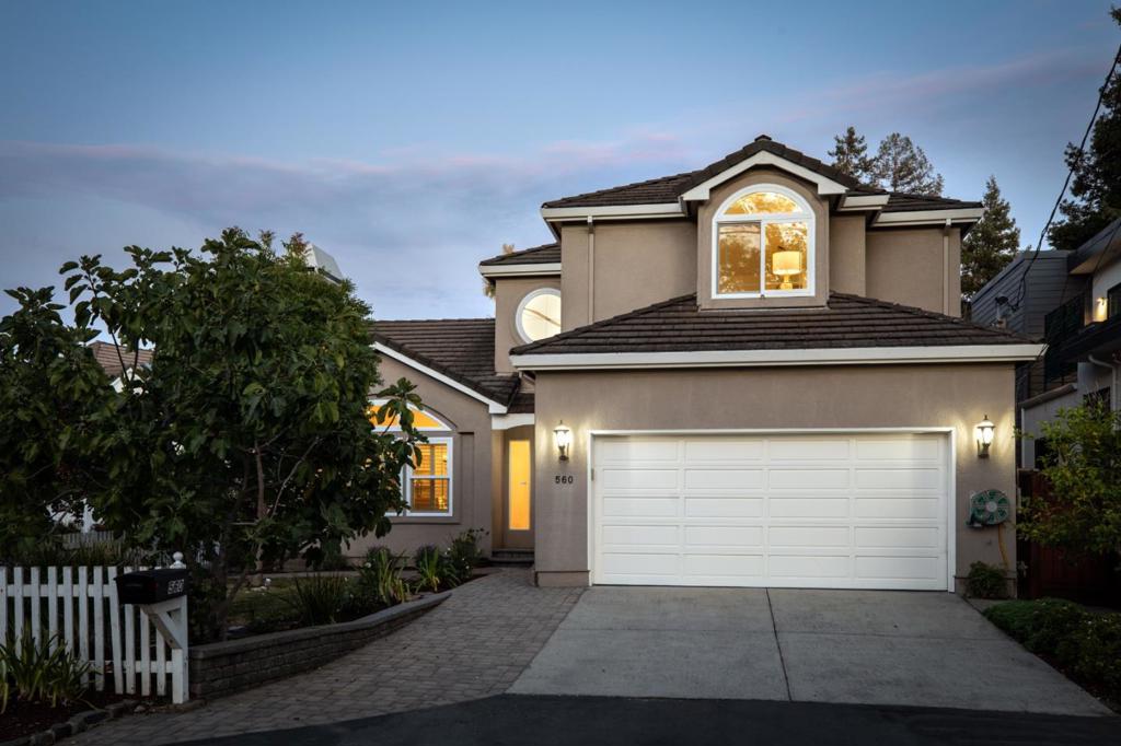 Increase your quality of life with this grand yet deeply comfortable 4-bedroom, 3-bathroom traditional home in Menlo Parks' beloved Fair Oaks neighborhood. Spanning over 2,600 square feet, this residence greets you with a dramatic two-story entry and a sweeping circular stair case - setting the tone for a home that blends elegance with livability. Downstairs, enjoy a flexible layout with formal living and family rooms, both anchored by cozy fireplaces, plus a full bedroom and bath ideal for guests, multi-generational living, or a home office. Upstairs, the primary suite offers tranquil treetop views of neighboring redwoods and oaks, dual vanity, 2 walk-in closets and a fireplace, while two giant secondary bedrooms - truly over sized - are connected by a full bath suite. Enjoy the tropical plants in the rear garden and feel like you're on vacation every day. A white picket fence adds curb appeal to the front yard. Walk around the corner to enjoy the neighborhood park. Located at the entrance of a quiet cul-de-sac, this home is part of a warm, tight-knit community of professionals, families, and friends. Super quiet and serene while being just minutes to Meta, Stanford, Hwy 101, and top private schools like Synapse, Sacred Heart, and Nativity.