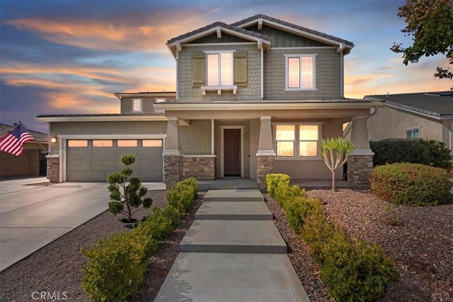 Welcome to 16951 Satsuma Avenue, a stunning hillside retreat in Riverside offering sweeping panoramic views and exceptional indoor-outdoor living. This beautifully designed home showcases incredible curb appeal with a spacious front porch and manicured landscaping, all set against the backdrop of breathtaking vistas. Inside, the home welcomes you with an airy open floor plan, abundant natural light, and elegant finishes. The living room features high ceilings and expansive windows framing the views, while the gourmet kitchen offers granite countertops, stainless steel appliances, a large center island, and ample cabinetry. A formal dining area and comfortable family spaces make this home ideal for both entertaining and everyday living. The layout includes a highly desirable downstairs bedroom and full bathroom, perfect for guests or multi-generational living. Upstairs, the primary suite is a private sanctuary with a spa-like bathroom and a balcony where you can take in the stunning mountain and city light views. Secondary bedrooms are generously sized with flexible options for family, office, or hobbies. Step outside to your entertainer’s paradise—complete with an expansive patio, an outdoor fireplace for cozy evenings, and multiple seating areas where you can enjoy the “killer view.” The backyard seamlessly blends comfort and natural beauty, offering the perfect setting for gatherings or quiet relaxation. Additional highlights include a spacious three-car garage, a well-appointed entry foyer, and a prime location near schools, shopping, and commuter routes—while still providing the privacy and tranquility of hillside living.