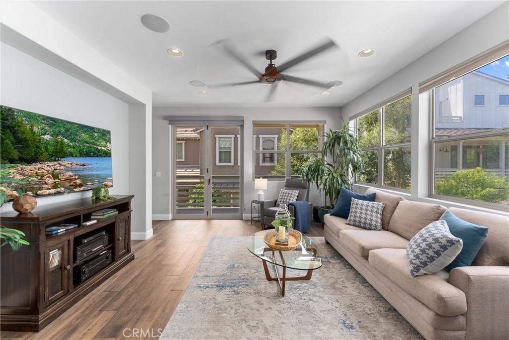 *SELLER OFFERING A $5,000 CONCESSION TOWARD BUYER'S CLOSING COSTS OR RATE BUY-DOWN, WITH REASONABLE OFFER!! * Welcome to the coveted Trellis community in Esencia, where Coastal Breezes Meet Country Charm.
This stunning home, centrally located in the award winning community of Rancho Mission Viejo, is where indoor and outdoor living merge to bring you the best of both worlds, year-round. Marisol offers luxurious upgrades, a functional floor plan, and unbeatable views. This turn-key residence includes new paint, water softening system, reverse osmosis system, and brand new carpet throughout.
The show stopping highlight is the spacious Rooftop Deck boasting the best sunrise/sunset and rolling hill views in the tract—perfect for entertaining or unwinding under the starlit skies. As you step inside the first floor entry, you'll be greeted by a large, bedroom or office with a beautifully finished half bath. The second story is where the magic unfolds. This floor offers a spacious guest room with barn door, large living room with surround sound and bi-fold door leading to a cozy and serene lanai, and an open concept chef's kitchen featuring stunning gray cabinetry, tile backsplash, upgraded stainless steel appliances including a double oven, and a spacious peninsula with countertop seating. The third level is reserved for the serene primary suite, which proudly boasts a completely custom, wood, walk-in closet organizer system. You'll be spoiled for life with this dream closet! This level also hosts an oversize 3rd bedroom with full bath and a laundry closet for convenience. Conclude your home tour by visiting the 4th story Rooftop Viewing Deck! Bring a pen, because by the time you make it to this expansive space, the views and party dreams will have you ready to sign on the dotted line!
Epically located approx. 15 minutes from several of Orange County’s best beaches and 5 minutes from historic Old Town San Juan Capistrano. This is arguably the most-walkable location in Esencia. Close to Live Oak trail, Esencia K-8 school, NEV biking trail system, community farm, indoor/outdoor gym & multipurpose facility, sport courts of every kind, a coffee shop, parks, resort-style pools, and even an arcade! Rancho Mission Viejo offers first in class amenities for the entire family!
