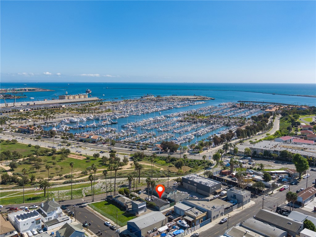 Fabulous opportunity to acquire a very unique property situated just a short distance from the West Harbor waterfront development that is in full swing and scheduled to have it's Grand Opening in 2026. The property is zoned LAMR1 which per the attached Zoning Regulation Summary means the property can be used for Manufacturing, Commercial, Multi-Family Residential and Single Family Residential (buyer to verify with local government agencies). Ther currently is a building that can be used as a home, office or combination of both. It is currently used as office/storage space for the existing tenant who operates a construction business. Crescent Ave sits on a rim offering wonderful views of the harbor, marina and walking trails. Tenant's lease runs through May, 2027 but if you look at the bright side it provides income while you get through the planning and permitting process for whatever you would like to build here. See Summary of Zoning Regulations in Supplements for additional zoning information. SELLER WILL CONSIDER CARRYING THE LOAN FOR A 3-5 YEAR PERIOD WITH A MINIMUM OF 30% DOWN.