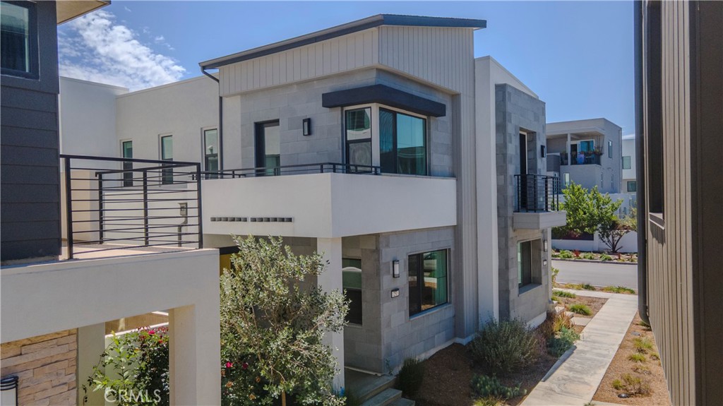 Amazing opportunity to lease a gorgeous modern home in Irvine! Welcome to the highly sought-after Revo Community at Novel Park! This beautifully designed residence offers the perfect blend of contemporary style and thoughtful functionality across two spacious levels, with 3 Bedrooms, 2.5 Baths, and an attached 2-car garage.
The open-concept main floor is ideal for both everyday living and entertaining. At the heart of the home is a stunning chef’s kitchen, featuring white shaker cabinetry, beautiful quartz countertops, and a generous oversized island—perfect for casual dining or hosting friends. The space flows effortlessly into the expansive great room, enhanced with built-in surround sound for the ultimate movie night or game day experience. Just off the kitchen, a private patio invites you to enjoy al fresco dining or a peaceful morning coffee.
Upstairs, the serene primary suite serves as a personal retreat, complete with a private balcony, a spa-inspired ensuite with dual vanities, and a large walk-in closet. Two additional bedrooms, a full bath, and a dedicated laundry room complete the upper level.
The attached garage features a polished epoxy-coated floor—both durable and stylish.
Living in Novel Park means more than just a beautiful home. Enjoy access to resort-style pools, scenic walking trails, clubhouses, dog parks, playgrounds, and “The Cup,” the neighborhood’s favorite local coffee shop. You’ll be within walking distance of Beacon Park K–8, a short drive to Portola High, and just minutes from Woodbury Town Center. Prime location, and so convenient to freeways, shopping, schools and recreation! The Great Park is an incrediable place to live!