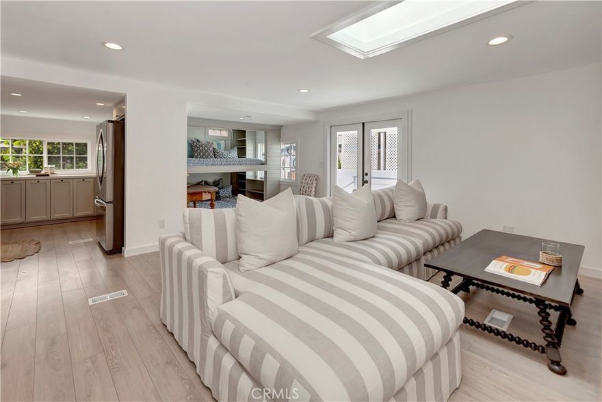 COMPLETELY remodeled manufactured home in Bayside Village in the heart of Newport Beach with undermarket land lease.  Just steps to Back Bay, marina, private beach, bay side pool/spa/clubhouse and recreational facilities. Just minutes to Balboa Island, Fashion Island and world class beaches & restaurants.  Property has been completly renovated by a  designer out of Malibu, CA. The interior includes new doors, flooring, cabinets and bunk room. Newer windows, bathrooms and barn sliding bathroom door make up the primary suite. An extra large deck with designer tile and private fenced in area for entertaining. Fences and gate access completely enclose the property.  A large covered carport for your vehical.  Property is on leased land with a rare under market land lease of $2951 monthly  (normal market rent on this location would be $3300 monthly) which includes water & trash and numerous community amenities including 2 clubhouses/pools/jacuzzis, private beach, sports court, barbeque/picnic areas, gym and DOG PARK!   There are no HOA dues or land taxes.
