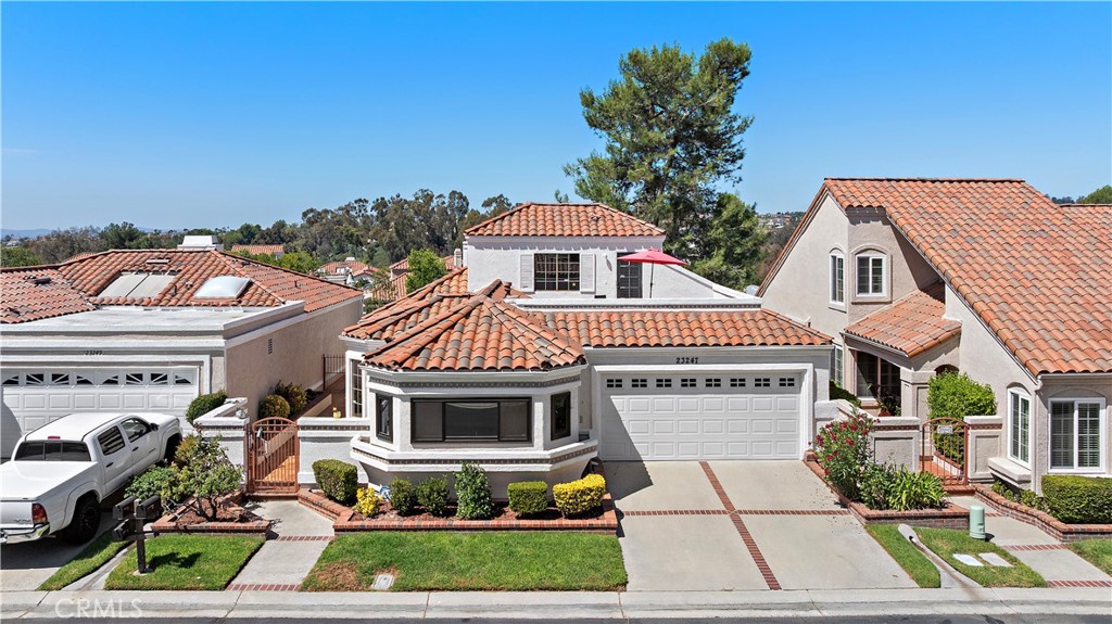 Impeccable View Home in Prestigious gate guarded Casta del Sol – A Rare Gem. Welcome to this stunning Pebble Beach with Loft floorplan, ideally situated on one of the most desirable streets within the gated, 55+ community of Casta del Sol. Offering 1,740 square feet of luxury living, this beautifully upgraded residence features two spacious bedrooms, three full bathrooms, and a versatile loft perfect for a home office, guest space, or hobby room. Enjoy breathtaking views and serene surroundings from your private haven. The main floor boasts primary suites with soaring vaulted ceilings, providing comfort and convenience all on one level. The second bedroom, also located downstairs, is adjacent to a full bath—ideal for guests or an office. This home has been thoughtfully upgraded with over $135,000 in recent improvements, including: A fully remodeled kitchen featuring sleek European-style cabinetry, quartz countertops, and new stainless-steel appliances (including a matching refrigerator). A gorgeous primary bathroom with skylights, a custom walk-in shower, double vanity, and updated fixtures. New Anderson windows in the kitchen and primary bedroom, plus a new sliding glass door in the living room. LED recessed lighting throughout for a warm, modern ambiance. Large enclosed and covered back patio spans the entire back of the home. New garage door and opener, epoxy-coated floors. Upgraded electric panel that can accommodate EV charger for your electric vehicle. This home is a true showcase of quality and comfort, offering a lifestyle of ease and elegance. Nestled in the heart of Casta del Sol, a community spread across 484 acres of rolling hills, mature trees, and manicured landscapes, residents enjoy access to two resort-style recreation centers with a wide range of amenities, including: Pickleball & Tennis Courts. Swimming Pool & Spa. Lawn Bowling, Sport Courts & Gym. Billiard Room & Clubhouse. Beautiful walking paths and organized activities. HOA covers exterior painting, front yard maintenance, trash pickup, and common area landscaping, ensuring a low-maintenance lifestyle. As a resident, you’re also a member of Lake Mission Viejo, where you can enjoy picnicking, swimming, fishing, concerts, and more. This is more than just a home—it's a vibrant lifestyle in one of Orange County’s premier active adult communities. Come experience the beauty, comfort, and community of Casta del Sol. Welcome home.