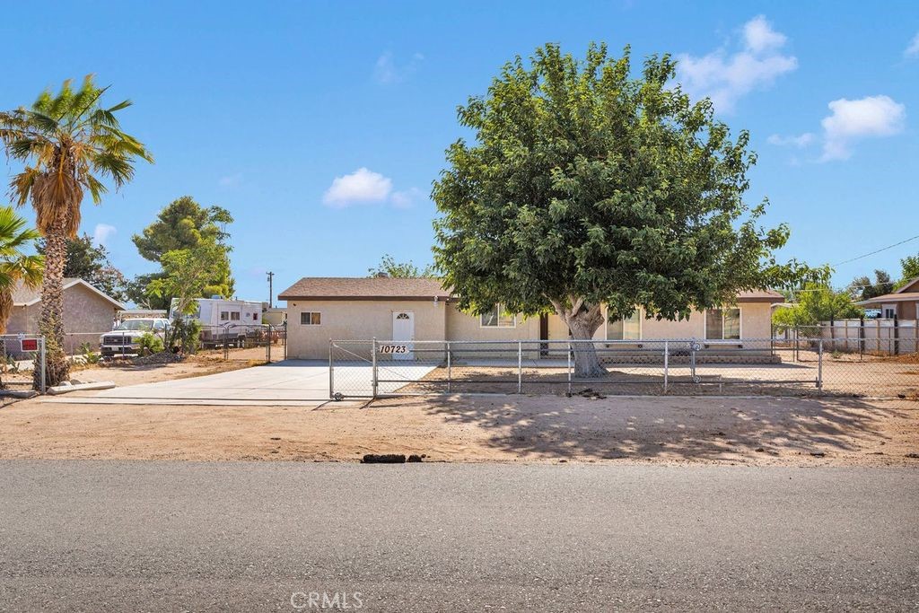 Wonderful Hesperia home features 5 bedrooms ( 2 of the bedrooms do not have closets) 2 nicely appointed bathrooms. This charming home has had some recent updates including new carpet, some areas freshly painted, newer heat/ac system ( 2024) freshly painted exterior facia, newer windows. Great floor plan large kitchen with granite counter, tile floor, dining area, generous size living room with beautiful brick fireplace, huge bonus room with wood stove, back yard access, indoor laundry area. Exterior features include several out buildings, completely fenced, close to shopping and schools. Make your appointment today to see this wonderful home!