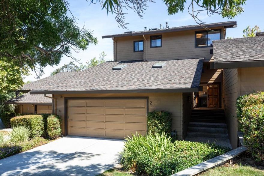 Welcome to a residence that epitomizes refined living, where timeless style and modern comfort come together in the coveted Sharon Hills community. A dramatic double-door entry opens to soaring ceilings, luminous interiors, and custom-crafted finishes that create an atmosphere of sophistication and ease. The thoughtfully remodeled kitchen, expansive living and dining areas, and seamless indoor-outdoor flow set the stage for both relaxed daily living and effortless entertaining. The primary suite is a true retreat, featuring vaulted ceilings, a private balcony, a spa-inspired bath, and a fireplace that adds warmth and elegance. Beyond the interiors, a serene patio invites year-round enjoyment, while community amenities such as a pool and tennis court further enrich the lifestyle. With its excellent location near shopping, recreation, and top-rated schools, this home offers an exceptional blend of elegance, comfort, and convenience.