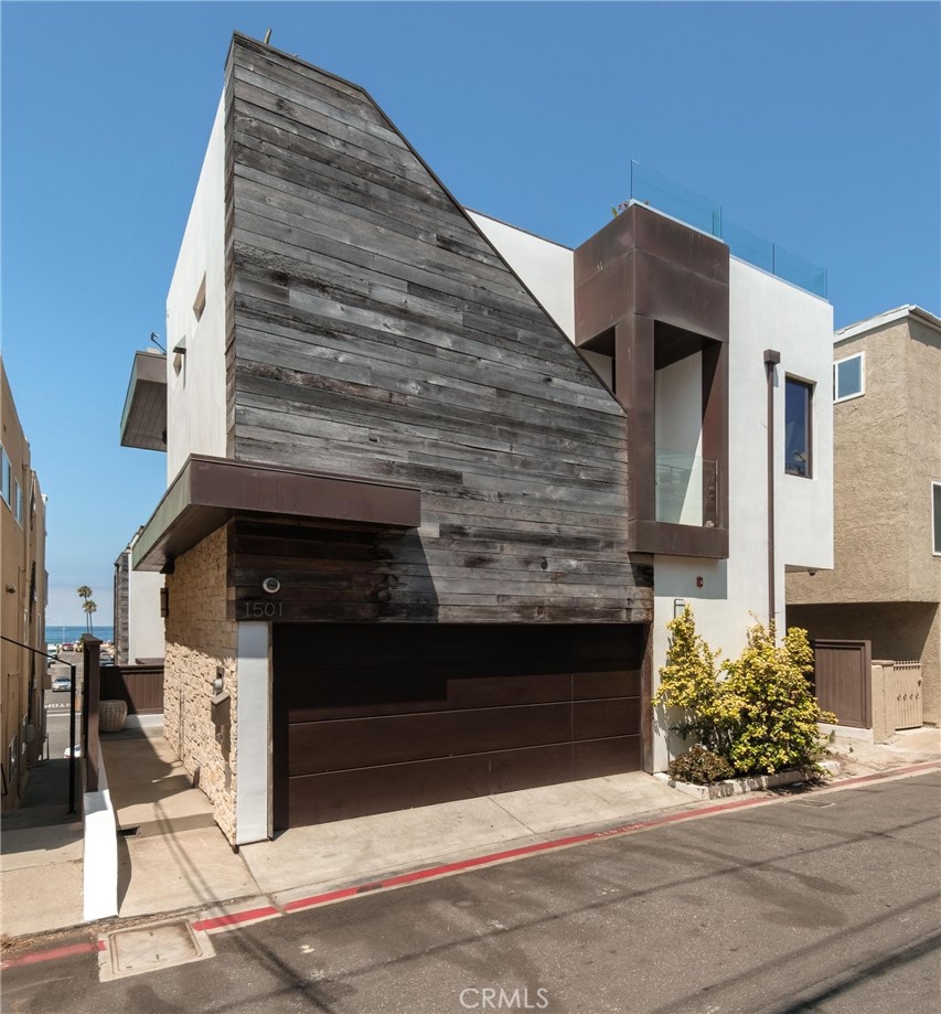 Renowned Starr-designed home located just one block off the sand and slightly north of downtown Hermosa Beach's cafes, spas, stores, restaurants, gyms, and so much more. Beach living is the name of the game. With inspiring front lit waves greeting you in the morning and soothing sunsets bidding you goodnight, 1501 Palm Drive is ready to welcome you.
Consisting of approximately 2,975 square feet, with 4 bedrooms and 4.5 bathrooms, a convenient 3-stop elevator, and unblockable point-to-point ocean views from your sprawling approximately ~600 square foot rooftop deck, this home is perfect for entertaining. Blending smooth white stucco with rough split limestone, weathered reclaimed barn wood, rich mahogany windows and doors, and copper paneling, this home is oozing with luxury and refinement at every turn. The well-appointed kitchen and great room offer a center island, pantry, and top-of-the-line Thermador appliances. Summer kitchen upstairs on the huge deck with a big spa tub, dinning table, elevated couch and oversized sun beds, all with dramatic, panoramic ocean views.
Live "the-dream-location" in a home spacious enough for a large family, where one can park their car on Friday and not need to pick up the keys again until Monday. With an impressive walk score of 90, this home's location is a true "walker's paradise" where daily errands do not require a car. Time is our greatest resource and it is fleeting - this incredible home offers the perfect solution! Just bring your sunblock and get ready to soak up the laid-back beachside lifestyle.