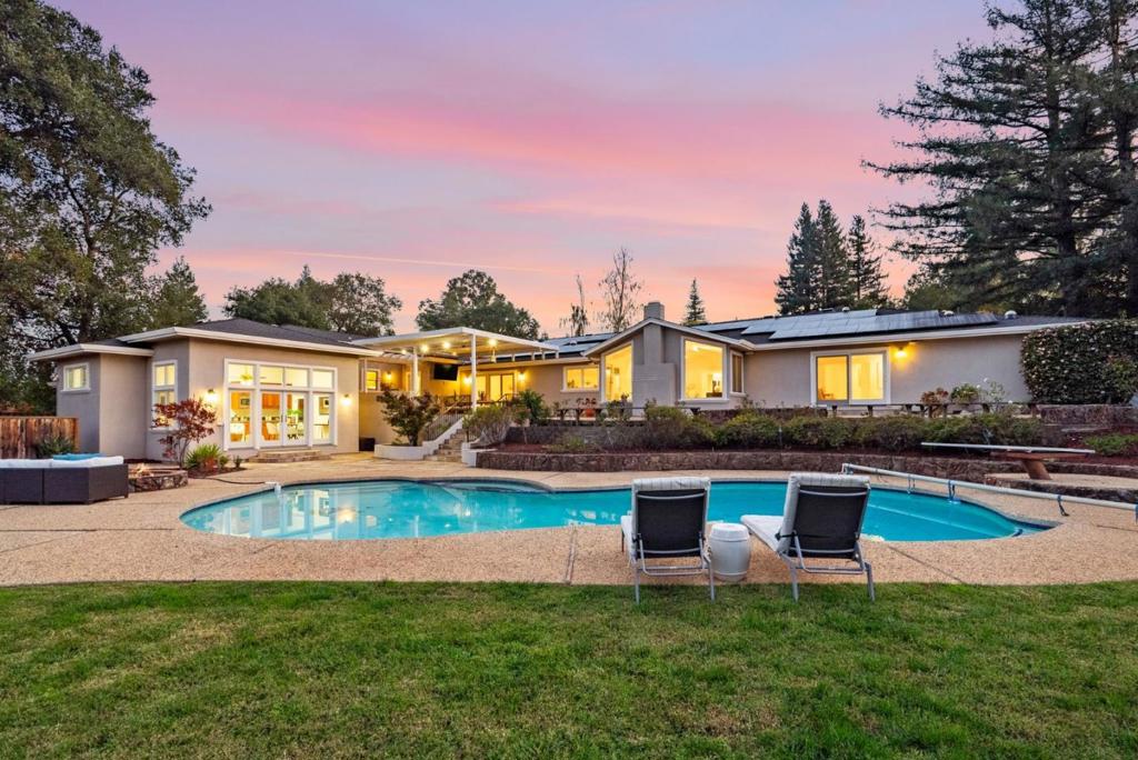 Welcome Home to 19305 Zinfandel Ct in the Heart of One of THE MOST Sought-After Areas in All of Saratoga! Surrounded by Estates on Acre Lots, this Home is Located at the End of a Quiet Cul-de-Sac, and offers the Ultimate in Privacy. Flat, 40,000+ SF Lot. Single Level Living at it's Finest w/ High Ceilings & Five Bedrooms: All w/ En-suites! 5th Bedroom is in a Separate, Attached Pool House which could be Ideal for In-Laws, Live-In Nanny Quarters, or Pool Parties! Saratoga Schools w/in 5-7 Minutes of All Schools & Biking Distance to Redwood Middle! Brand NEW Hardwood Floors Throughout & Fresh Interior Paint! 85 Solar Panels, Two 220V EV Charging Plugs, Solar Powered Battery Back-Up! Solar Produced More Energy than used by owners. Four Large Walk-In Closets! Sun Tunnels & Skylights Throughout, Bathing the Home in Natural Light! Huge Kitchen w/ Gas Range & Large Central Island w/ Sink, Breakfast Bar & Warming Drawer! Large Breakfast Nook + Spacious Formal Dining Area Perfect for Holiday Gatherings! Family Room | Great Room w/ Wet Bar w/ Both Drink & Wine Refrigerators & Bar Seating! Double Laundry Machines for Multiple Loads! Entertainers Dream Backyard w/ Covered Patio w/ Automatic Rotating Shades, Heat Lamp, Outdoor Kitchen & Fire Pit! Basketball Hoop w/ 3 Pt & Free-Throw Lines!