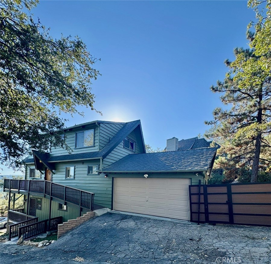 Incredible Lake View Home with Lake Rights in Arrowhead Woods! Discover this south-facing mountain retreat offering breathtaking lake views and full Lake Rights. With approx. 1,700 sq ft, 3 bedrooms, and 2.5 bathrooms, this home is designed for both comfort and versatility.
The main and upper levels feature spacious living areas with sweeping lake views and access to newly redone decks, perfect for relaxing or entertaining. Downstairs, the game room has its own separate entrance, creating a private retreat.
Recent upgrades include fresh exterior paint, new cooling unit in the primary room, updated decks, and dual-pane windows and sliders for year-round efficiency. A two-car garage and private courtyard.
Enjoy serene views from nearly every window, modern comforts throughout, and a prime location close to the hospital, schools, Lake Arrowhead Village, and the local fire department, providing both convenience and peace of mind.