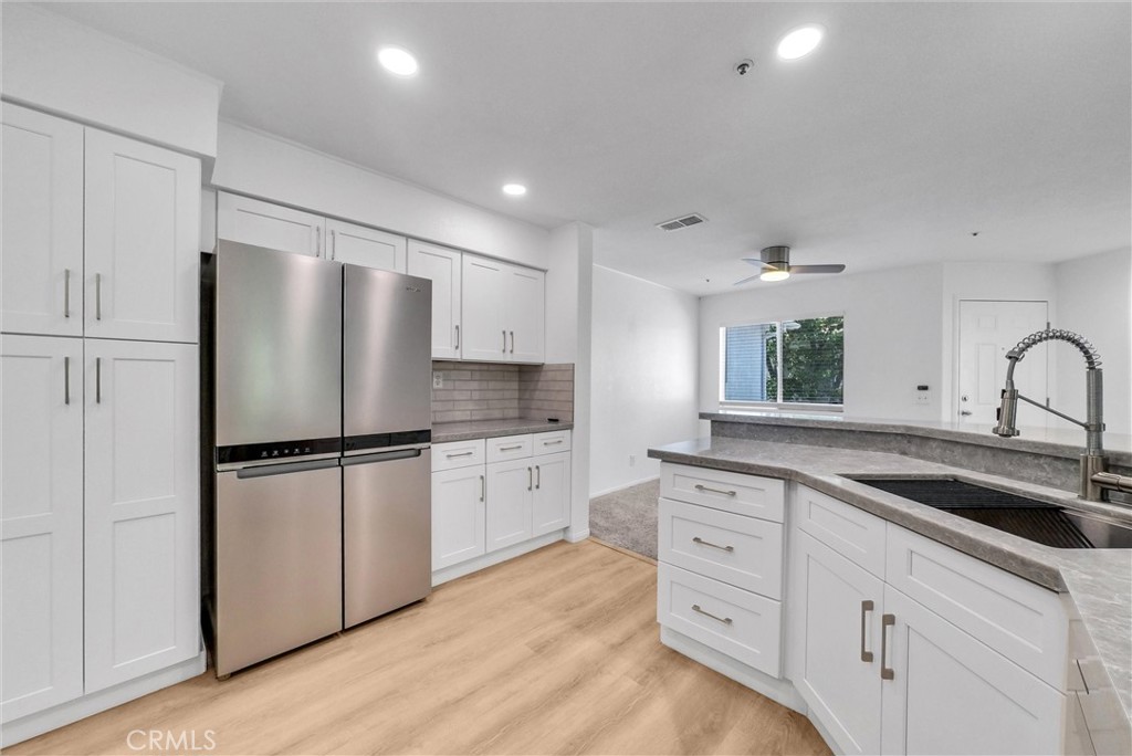 Welcome to the prestigious community of Hampton court in Butterfield Ranch.
This pristine 2 bedroom, 2 full bath condominium is charming and remodeled throughout.
An open floor plan that has a fireplace in the family room, opens to the kitchen with recessed lighting, gorgeous Quartz countertops, a stainless steel oversized sink, a stainless steel stove/oven, stainless steel microwave, stainless steel dishwasher, newer white shaker cabinets and brushed nickel hardware.
Just off the kitchen is your own dining room with a ceiling fan and a long bar top that seamlessly connects your kitchen to your dining. A simple yet sophisticated set up when hosting dinners or get togethers with a lot of open space.
The bedrooms conveniently have their own private full baths and are on opposite ends of the unit. Both bedrooms have stunning views. The primary has a large walk-in closet and a vaulted ceiling.
The laundry room is large with built-in cabinetry and 3 year old GE appliances.
A charming enclosed patio that faces Mount San Antonio and Cucamonga Peak. When winter comes along, you can see the white-capped snow filled mountains and it is simply breathtaking.
Storage in the enclosed patio along with the HVAC / newer water heater to access in a cinch! The large storage area is ideal for keeping those extra items tucked away until you really need them without having to deal with clutter. Aside from ample open parking in the community, this unit features a single private enclosed garage.
Enjoy the summers poolside or at the community picnic area when you need to relax and unwind.
Close to shopping, the 71 freeway, the 60 freeway and the Prado regional park. It’s not only sophisticated, it’s convenient for commuters that want to have luxury and accessibility.
This wonderful single story, upstairs end unit gives you unparalleled privacy.
You will love this location and all that it has to offer! Bring your buyers and they will fall in love with this beautiful condo!