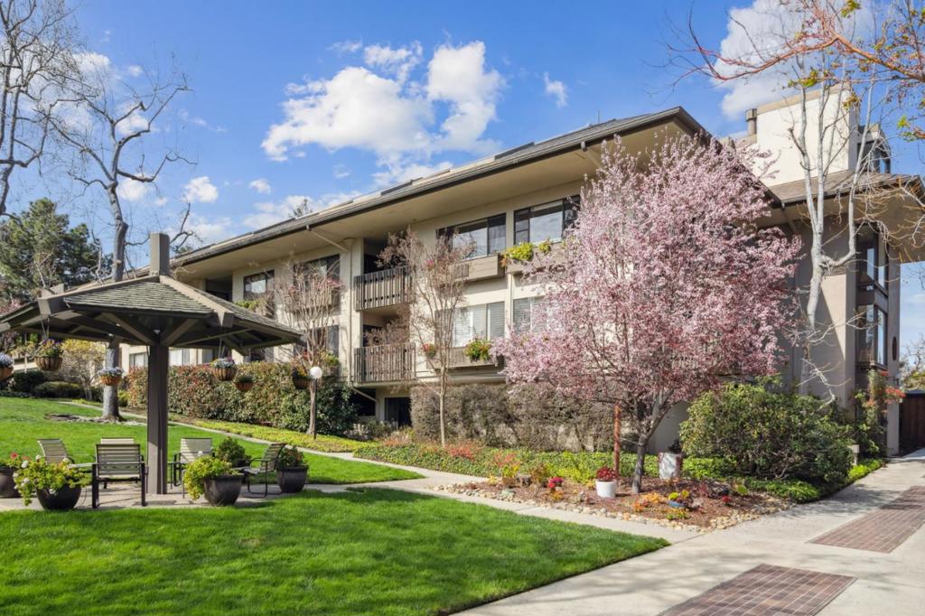 Welcome to this spacious 2-bedroom, 2-bath condominium in the desirable Menlo Commons development. Located on the second floor, this freshly painted and newly carpeted unit offers light-filled rooms overlooking the mature gardens. An open plan living room, dining area and kitchen with a seamless connection to the private deck creates an intimate space for entertaining. The spacious primary suite includes a sitting area and/or small office space, a large walk-in closet, and en-suite bath with a sizeable linen closet. The second bedroom suite includes deck access and connects to the additional full bath. This bath contains the in-unit washer/dryer, an oversized wall closet and an additional storage closet. Photos virtually staged. Association amenities include a heated pool, spa, well equipped gym and large resident lounge with a conference room and fully equipped kitchen including dinnerware. This ideal location is just minutes to the Stanford and Sharon Heights shopping centers, Stanford University and Hospital, downtown Menlo Park and commute routes.