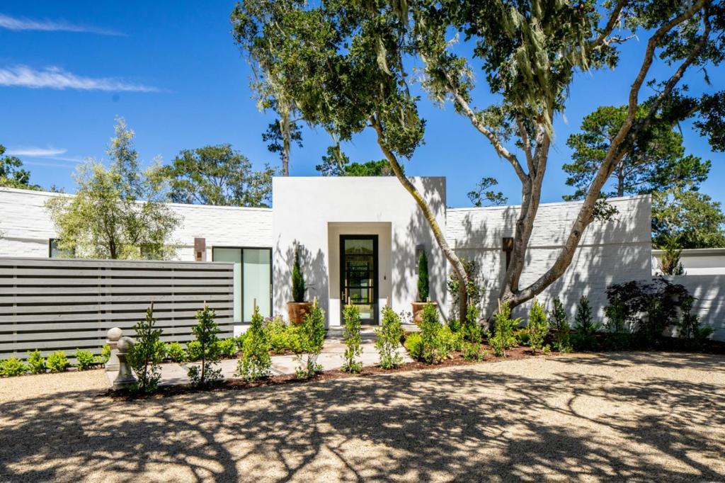 Located in the sunbelt, just up from the Lodge, this striking single level modern home is the perfect retreat to take in sunsets of the Pacific. The home features 4 en-suite bedrooms and is bathed in natural light with skylights and Western glass doors that make indoor/outdoor entertaining a breeze. The large, parklike backyard features an outdoor kitchen under a large pergola, a sunny seating area with a gas firepit, and a wrap-around deck featuring a hot tub with views of Point Lobos and Fish Ranch. The master suite features floor to ceiling sliding doors leading to the wrap-around deck showcasing ocean views, a linear fireplace, two walk-in closets, a large bathroom, soaking tub and steam shower. Perfect for a car collector, the 3 car garage has the potential for up to 6 cars with the installation of a car lift. Taking elements of the original architect's vision for the property, this reenvisioned mid-century modern home has been brought back to life into a serene work of art.