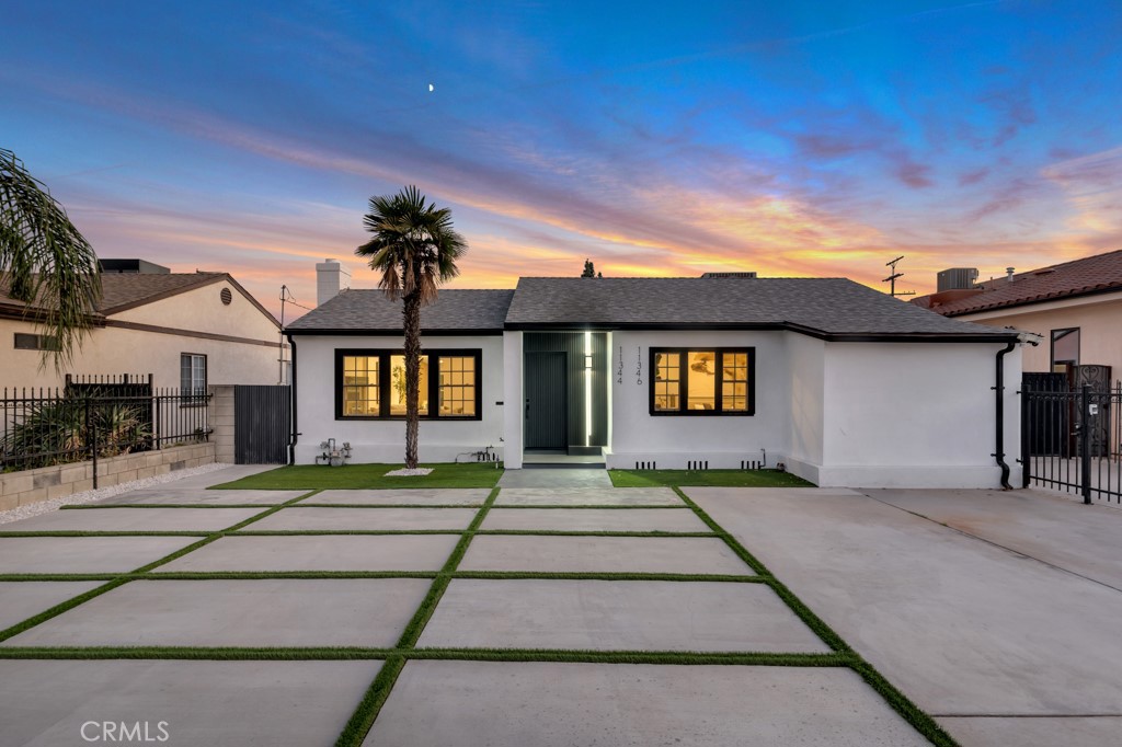 Introducing this beautifully upgraded single-family home in North Hollywood! Spanning 1,650 square feet, this charming residence features 3 bedrooms and 2 bathrooms. Upon entering, you'll be captivated by the exquisite details, including stylish light fixtures, textured walls, and stunning marble countertops. The entire home boasts elegant engineered wood flooring and recessed lighting, creating a warm, inviting ambiance.
Step into the cozy living room, complete with a sophisticated fireplace that adds character to the space. The first bathroom, conveniently located in the hallway, showcases a modern design with a floating vanity and a skylight that fills the room with natural light. The primary bedroom includes two spacious closets and an ensuite bathroom for added convenience.
The gourmet kitchen is a chef's dream, equipped with a 36-inch professional-grade stove, luxurious marble countertops, a large island, and custom cabinetry. This area flows effortlessly into the open living and dining spaces, making it perfect for entertaining guests. The third bedroom, situated near the dining room, offers flexibility as a potential home office.
The thoughtfully designed landscaping and hardscaping enhance the property’s appeal, all framed by a secure perimeter gate that ensures privacy and safety. Additionally, a detached garage at the back presents an exciting opportunity for a fully permitted ADU conversion (approximately 566 sq. ft.), with paid plans available for a 1-bedroom, 1-bathroom unit.
This property is move-in ready and ideally located close to the vibrant NoHo Arts District, a variety of shopping and dining options, and major freeways, making it a perfect blend of luxury living and future income potential. Don’t miss out on this incredible opportunity!