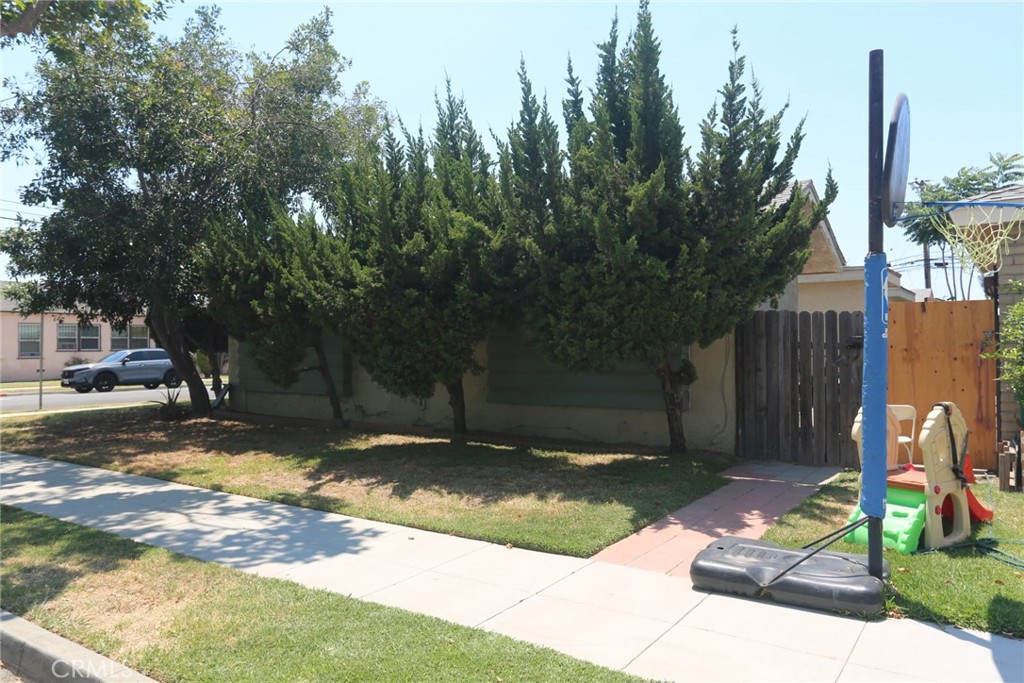Triplex. property Profile indicates 7 Bedrooms and 4 Baths. Units all attached. Appears to have a double garage and a single garage off cement alley. I have seen the inside of 6003 and 6005 and have met the tenants in those 2 units. Very nice tenants. Both are 2 bedroom one bath units in good condition. Between the front and the rear of the building on the north side are fencing and gates creating privacy for tenants. Units are numbered 6--1, 6003, and 6005. Units seem to be in good condition. .