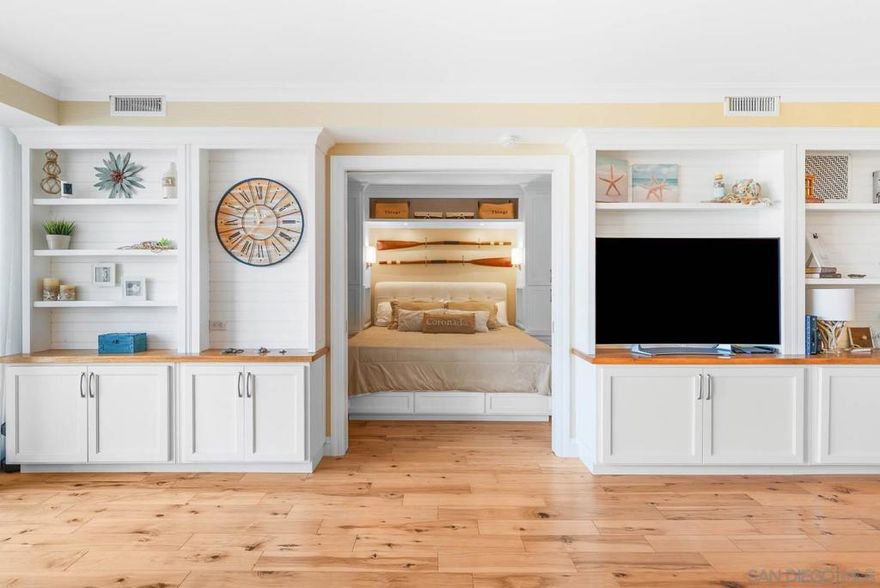 Located just minutes from the sand, this turnkey, fully furnished studio in coveted La Sierra Tower features a fresh, beach aesthetic. is beautifully Renovated by Clark Construction, enjoy breathtaking views of the Hotel Del Coronado with thoughtful upgrades that include new windows, wood floors, crown molding, and custom built-ins throughout, offering both beauty and function. The kitchen is a standout with high-end Bosch and Viking appliances, custom cabinetry, and a breakfast bar. A spacious walk-in closet, dining nook, and elegant bath with walk-in shower round out this coastal retreat. Move right in and start experiencing The Shores lifestyle!