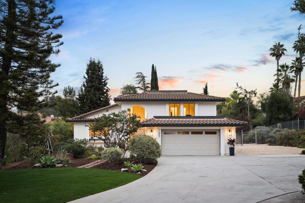 Positioned at the end of a QUIET CUL-DE-SAC in the hills of Vista, 1657 Foothill Drive is a FULLY RENOVATED home designed for abundant living, with room to grow. With 4 BED/3 BATHROOMS and an OPEN-CONCEPT layout across three levels, it offers both flexibility and privacy for modern life. The main floor features elevated ceilings, natural light, and a thoughtfully finished kitchen with oak shaker cabinetry, quartz counters, and brand new appliances. Two living areas create space for connection and retreat, while the BRAND-NEW MUDROOM adds practical function. A private suite on the lower level is perfect for guests or a HOME OFFICE. Upstairs, three bedrooms offer treetop views. Throughout, LVP FLOORING, neutral tones, and natural textures define a warm, modern aesthetic. Set on a SPACIOUS .59-ACRE LOT, the fully fenced, flat backyard with dedicated RV PARKING is ready for a POOL, expanded garden, ADU, or even a chicken coop, and just minutes from downtown Vista.
