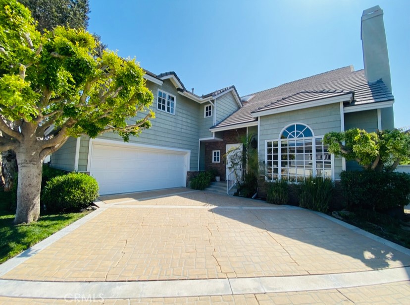 Rare Lease Option Opportunity! Welcome to 4192 Shorebreak Drive, a beautifully maintained and spacious 5-bedroom, 4.5-bath residence in the highly desirable gated community of Faire Marin in Huntington Harbour. This home is available with a lease option to buy, allowing a portion of rent to be applied toward the future purchase price or down payment.Offering 4,272 sq. ft. of living space, this coastal home features a sought-after main floor bedroom with full bath, plus a guest powder room. Freshly painted and move-in ready, it boasts new flooring, new light fixtures, and an entertainer’s kitchen with a large center island, stainless steel appliances, and new countertops currently being installed. The spacious floor plan includes a formal living room with fireplace, an elegant dining room, a wet bar perfect for entertaining, a bright family room, and a versatile loft. Oversized bedrooms and a dedicated office/library provide ample space for work or relaxation.Enjoy the Southern California lifestyle just steps from Huntington Harbour Mall, Trader Joe’s, restaurants, top-rated schools, and parks. Walk to Humboldt Park (Mothers Beach) for paddleboarding, kayaking, or safe swimming in the shallow, roped-off area. Stroll or bike to Sunset Beach for live music, beachside dining, and the vibrant boardwalk. Community amenities include tennis courts, scenic harbor walks, and easy access to nearby beaches.This is a rare chance to lease in one of Huntington Beach’s premier neighborhoods—with the option to make it your forever home.