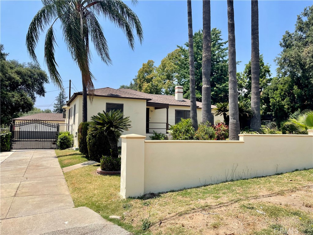 Come home to this picturesque mini estate, located on an expansive lot, in a quiet established Altadena neighborhood. This home offers original wood floors with an abundance of windows filling the home with natural light. The home features a formal living room with a fireplace, a large den overlooking the over-sized backyard, formal dining room and a bright renovated kitchen with plenty of cabinet space, stainless refrigerator, gas stove and room for a eating nook with and a bay window overlooking the community. The home is equipped with central a/c and heating system, laundry room with its own full bathroom boasting a jaccuzi tub adjacent to the detached garage. Dog families, we have an enclosed dog run with attached pet quarters. This home is the ultimate in country living and yet, conveniently, just a few minutes from the freeway and shopping. If you're looking for a home with exceptional outdoor living space, a great location for hiking and biking, a whole lot of privacy and serenity, then, This Home Is A Must See!