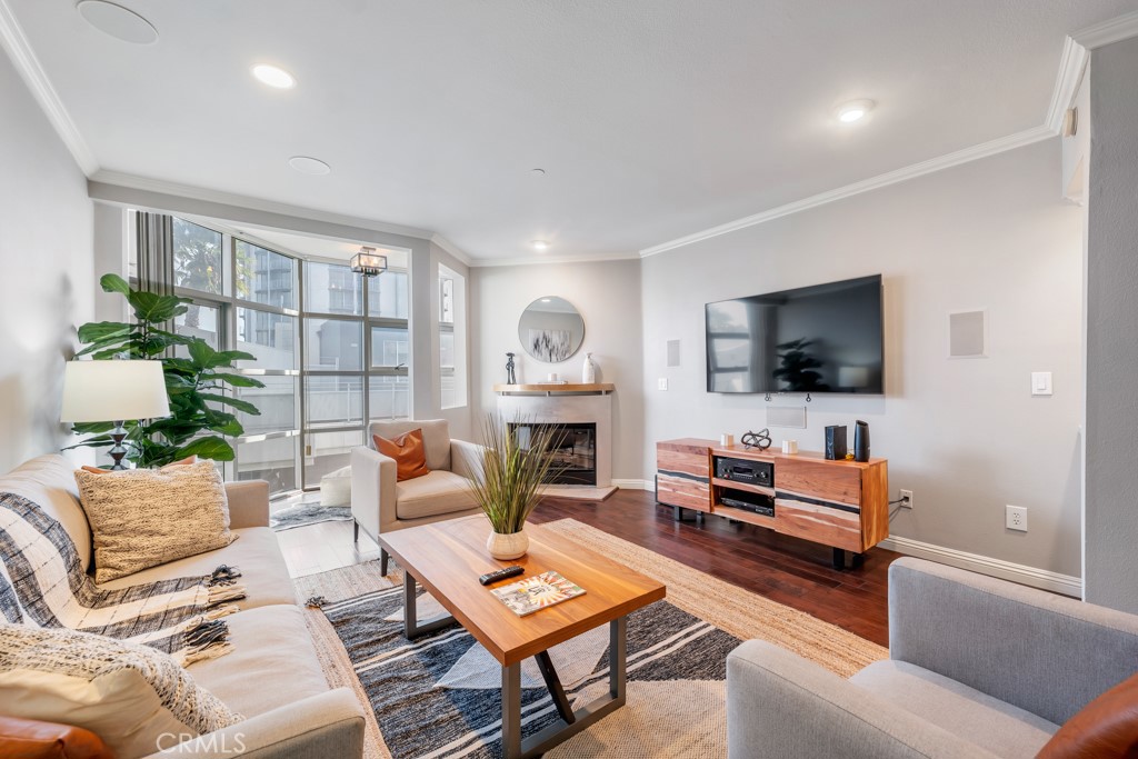 Discover the perfect blend of luxury and convenience in this exclusive, fully furnished, and remodeled 2-bedroom, 2-bathroom condo at 171 N Church Ln #514, Los Angeles. Boasting 1,408 SqFt of sophisticated living space, this rare rental-permitted unit is designed with high ceilings, custom-built surround sound, and a wine fridge, offering comfort and style in every detail. The thoughtfully soundproofed unit, equipped with double-paned windows, ensures a peaceful escape from the city’s energy despite its prime location near the 405 freeway.
The spacious primary bedroom features a king bed, walk-in closet with built-in shelving, and a large ensuite bathroom complete with a bathtub and separate standing shower enclosed by elegant glass panels. The second bedroom includes a queen bed, a desk for a functional workspace, and ample closet storage with custom shelving. A washer and dryer are conveniently located in a hallway closet, adding to the unit's practicality.
The remodeled kitchen shines with quartz countertops, light brown cabinetry, and stainless steel appliances, making it a pleasure for any home chef. Enjoy meals in the cozy breakfast nook or the dining area. The living room, complete with a fireplace, provides a welcoming ambiance, enhanced by a large flat-screen TV, with an additional flat-screen TV in the primary bedroom for added convenience.
This unit includes two assigned parking spaces (#121 and #122) with additional storage above spot #122. Building amenities include a pool, gym, and sauna, with privacy ensured by a mostly owner-occupied community. Nestled above the bustle, the condo offers a safe and serene lifestyle, with proximity to the Luxe Hotel and the Getty Museum. Convenient access to both Brentwood and Bel Air’s renowned attractions makes this a truly extraordinary rental opportunity.