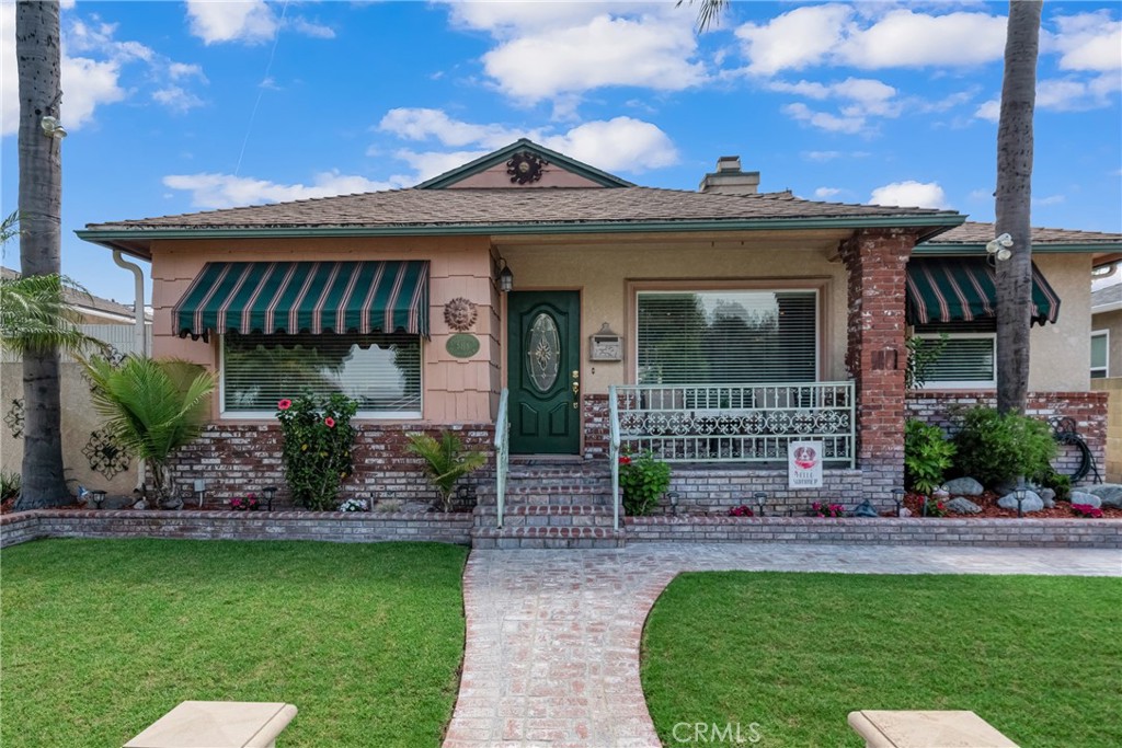 This pride-of-ownership 2-bedroom, 1-bath home offers 1,076 sq. ft. of comfortable living space, complete with a 2-car garage and a long driveway for ample parking. Step inside to find crown molding, a cozy fireplace, and a functional layout ideal for everyday living.
The kitchen comes equipped with a refrigerator, and the home includes a washer and dryer for added convenience. The landscaped front yard welcomes you with a charming front porch, while the backyard is perfect for relaxing or entertaining, featuring an outdoor canopy and a separately gated pool area.
The garage area is also gated, providing privacy and security. This property is a great opportunity for buyers seeking a move-in ready home with both charm and functionality.