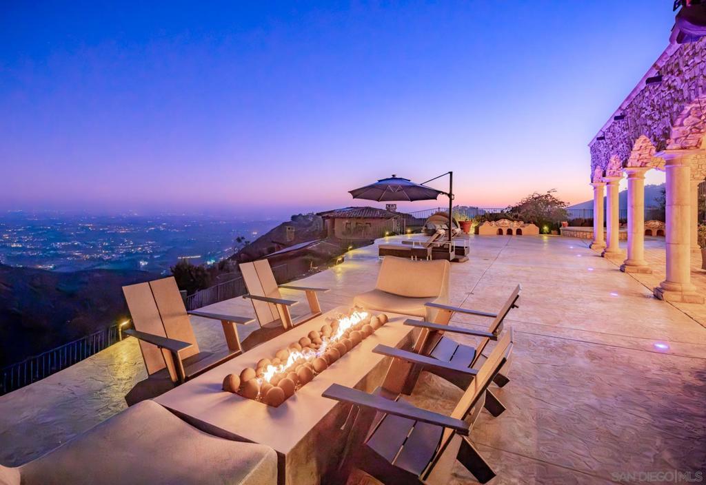 Panoramic forever views from this privately perched property in Rancho Santa Fe's coveted Cielo guard-gated community. This 4+ bedroom Villa, of timeless architecture, affords unsurpassed south-westerly views to the ocean. The Dena Gillespie designed estate is built w/ the finest material & craftsmanship, as well as reclaimed treasures from the past providing a sense of character & elegance to enhance the charm. This meticulous estate offers solar, a beautiful jacuzzi, private guest quarters, stunning courtyard & new backyard patio with firepit. The unique shape of the lot creates a 220+’ backyard boundary with room for infinity pool and sloping hillside ideal for a vineyard of nearly one acre. The home frames a courtyard with Vietri fountain and stone staircase. Gillespie homes are noted for their intrigue and mystique and this home does nothing to disappoint. The interior has been enhanced with modern amenities and contemporary styling. Cielo offers an exceptional lifestyle centered around the Cielo Club, an 8,000 sq. ft. facility featuring elegant event lounges, a catering kitchen, meeting rooms, a modern fitness center, and spa amenities. Outdoors, residents can enjoy a competition-sized pool, a children’s wading pool, a shaded pavilion with gas grills, tennis courts, and a playground. The Montagna Club adds even more with its own pool area, open-air pavilion, outdoor fireplace, and tennis courts. Spanning 1.5 acres, Cielo Park is a recreational haven with basketball and sand volleyball courts, a climbing wall, sports fields, and picnic areas with BBQs—perfect for active days and relaxed gatherings alike.