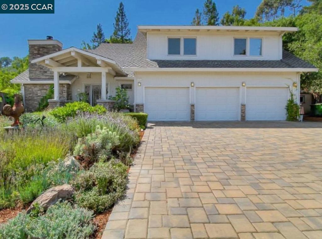 Tucked at the end of a quiet cul-de-sac on a half-acre lot, this beautifully updated two-story Craftsman offers a rare combination of privacy, space, & character. With 4 BDs, 3 full BA, & over 3,300SF of living space, the home blends classic architectural details w/ thoughtful modern upgrades. Inside, you'll find raised ceilings, custom millwork, & expansive windows that fill the space w/ natural light. The kitchen features high-end cabinetry and opens to a casual dining area and spacious family room ideal for everyday living and entertaining. Upstairs, three large bedrooms with maple floors offer scenic views, including a glimpse of Mt. Diablo. The primary suite includes vaulted ceilings and an attached office with a fireplace, built-in desk, and serene views of the backyard. A main-floor guest bedroom with a separate entrance and full bath offers additional flexibility. Outside, the landscaped yard feels like a private garden complete with mature fruit trees, olive trees, Japanese maples, winding paths, and multiple seating areas. A solarium, patio, lawn, and built-in pizza oven make the outdoor space as functional as it is beautiful. Additional highlights include a 3-car garage, rooftop solar, a wood-burning stove, and close proximity to downtown Orinda, BART, and Highway 24.