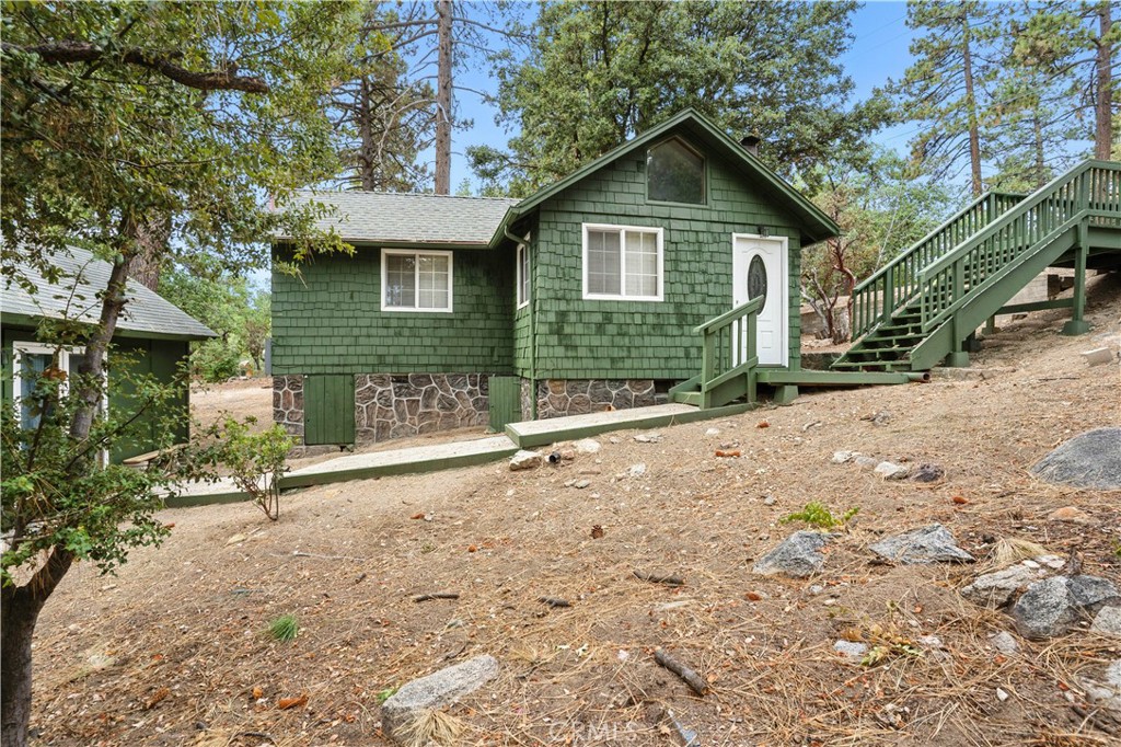 24990 Marion Ridge Drive, Idyllwild (2nd unit ADU is a must have!)
Nestled on nearly half an acre with a charming peekaboo view of the mountains, this adorable 2-bedroom, 1-bathroom home is full of character and opportunity. A unique corner lot surrounded by pine, oak, and cedar trees sets the scene, with a separate ADU which was previously used as a successful Airbnb could add extra value and flexibility. Short-term rental use (including Airbnb) may be an option; the community’s rental lottery remains open with spaces available
Thoughtfully updated in 2022, the home features a new septic system, electrical panel upgrade, partial roof replacement, and fresh wallpaper. The exterior received a new coat of paint in July 2025, giving it instant curb appeal. Inside, warm wooden accents, natural light, wood-beamed ceilings, a stone fireplace, and laminate flooring create a cozy mountain retreat. With plenty of parking and easy access from a county-maintained road, this property is just around the corner from local conveniences and only 3 scenic miles from downtown Idyllwild. Bonus: The detached studio will be delivered furnished for the new owner!
About Idyllwild:
Idyllwild is a true mountain oasis 6,000 feet above sea level and tucked away in the San Jacinto Mountains. Known for its towering trees, fresh air, and small-town charm, it’s the perfect escape from Southern California’s hustle. The area offers everything from world class hiking (including connections to the Pacific Crest Trail) to rock climbing at iconic Tahquitz Rock. Downtown Idyllwild is quaint yet vibrant, filled with one-of-a-kind restaurants, coffee shops, wineries, breweries, and boutique shops. A weekly farmers market adds to the charm. Whether you’re looking for a full time residence, a vacation home, or an investment property, Idyllwild continues to be a beloved destination for both locals and visitors. Now is the perfect time to claim your own piece of this special mountain community.