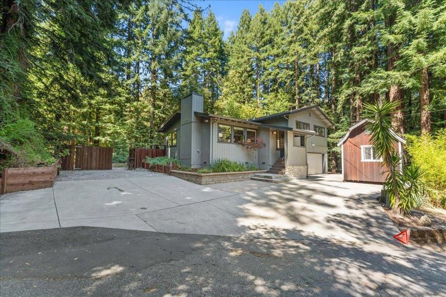 Welcome to 135 Sugar Valley Rd a serene and sunlit retreat nestled among towering redwoods. From the moment you arrive this home invites you to slow down and enjoy the perfect blend of modern living and natural beauty. Featuring a stunning updated kitchen complete with a center island, stainless steel appliances, & seamless flow into a sun-filled dining room that opens to a sleek contemporary deck, perfect for entertaining or unwinding. This flexible, light-filled home sits on a flat 2.84 acre partially fenced lot in a prime Scotts Valley location, offering room to garden, play, or expand. Inside, you'll find three spacious bedrooms plus a bonus room ideal as a fourth bedroom, office, or creative space. Hardwood floors, abundant natural light, & a peaceful neighborhood enhance the home's charm. Two workshops provide excellent space for hobbies, storage, or working from home. Enjoy a newer furnace, ductwork & water purification system. top-rated schools, nearby shopping & dining, & quick access to both Santa Cruz beaches & Silicon Valley. The outdoor space is generous & versatile, w/potential for pets, projects, or ADU. This home blends comfort, convenience with lifestyle, function and location. don't miss it