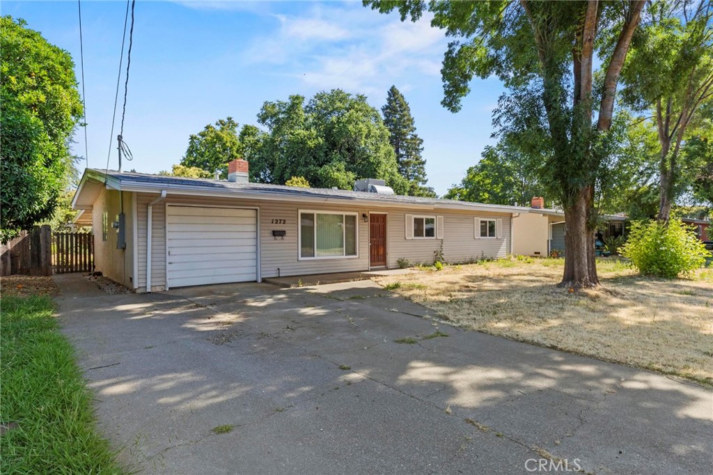 This is the opportunity you’ve been waiting for—an inviting 3-bedroom, 1-bath home that blends timeless character with thoughtful updates, all set on a spacious 0.21-acre lot. With 1,050 square feet of living space and a location close to parks, bike trails, shopping, dining, and outdoor activities, this property offers a lifestyle that’s both comfortable and convenient. Built in 1956, this home has been tastefully enhanced to suit modern living while still retaining the charm that makes it truly special. As you step inside, you'll immediately feel the warmth of the semi-open floor plan that creates a smooth flow between living areas. The living room offers a welcoming space for gathering or relaxing, complete with a fireplace that adds just the right touch of coziness. Ceiling fans throughout the home help maintain a pleasant atmosphere, while dual-paned windows allow for an abundance of natural light and energy efficiency. The updated kitchen is designed to meet the needs of everyday living with a clean, functional layout and modern finishes that will inspire your inner chef. Whether it’s casual meals or entertaining guests, this kitchen delivers both style and practicality. Laminate flooring throughout the home provides a modern touch, is easy to maintain, and creates a cohesive look across the living spaces. With central heating and air conditioning, you'll stay comfortable year-round, no matter the weather. The home also features an indoor laundry area, adding convenience to your daily routine. Each of the three bedrooms is well-proportioned, making this home perfect for a growing household, someone looking to downsize, or even a savvy investor. Step outside and the appeal continues. The fully fenced backyard offers privacy and room to roam, whether you’re entertaining, gardening, or simply enjoying the outdoors. The covered back patio is perfect for relaxing in the shade or hosting summer barbecues. An attached garage adds both parking and storage options, while the generous lot size provides endless possibilities for future customization or expansion. Located just minutes from scenic bike trails, neighborhood parks, and everyday amenities, this home offers the kind of lifestyle that’s getting harder to find—quiet, convenient, and full of potential. Don’t miss the chance to make this charming property your next home. Schedule your tour today and come see for yourself all the features and value this home has to offer.