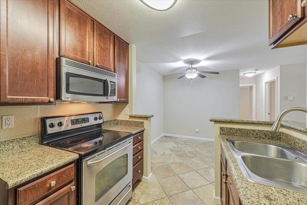 This gorgeous 2-bedroom, 2-bathroom condo in San Jose's Sierra Crest Community combines style, convenience, and excellent amenities! Step into the spacious living room filled with natural light, and you'll find a dual-paned sliding glass door that opens to your private balcony. The kitchen is designed with custom cabinets, sleek granite countertops, and stainless steel appliances. Bedrooms are thoughtfully crafted with dual-paned windows, ample walk-in closets, and a quiet ambiance. A Ring alarm system with motion detectors enhances peace of mind. There are ample available unreserved parking spots for second cars or guest parking! The Sierra Crest Community provides an impressive array of amenities, including a clubhouse, two sparkling pools with spas, a fitness center, and a scenic greenbelt area. Ideally located, this condo offers quick access to Valley Fair, Santana Row, San Jose City College, and Downtown Campbell. Nearby Highway 280 and 880 connections make commuting a breeze, while popular shopping, dining, and entertainment options lie just moments away. *Our homes come as-is with all essentials in working order. Want upgrades? Request it through the Belong app, and our trusted pros will take care of the rest. **Pet fee: $25/mo. per pet + $500 flat fee pet deposit.
