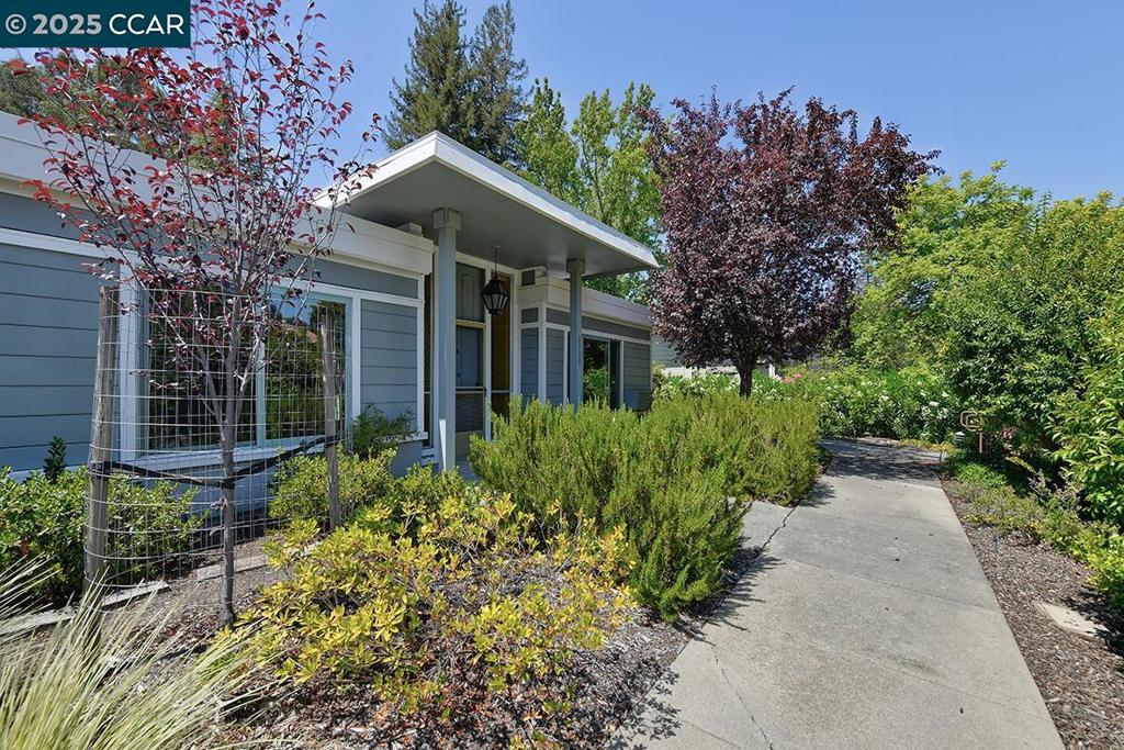 CONTRACTORS SPECIAL!!! A sought after Level In Golden Gate model that is Single Story, Single Row, End unit, overlooking Tice Creek Drive with open views of Eastern Hills and easy access to everything! Open atrium with Saltillo tile flooring and rear door for convenient access to Carport. Dual Pane Windows, skylight in bathroom and unique wood burning fireplace. Make it a dream home! Carport 1602-4.