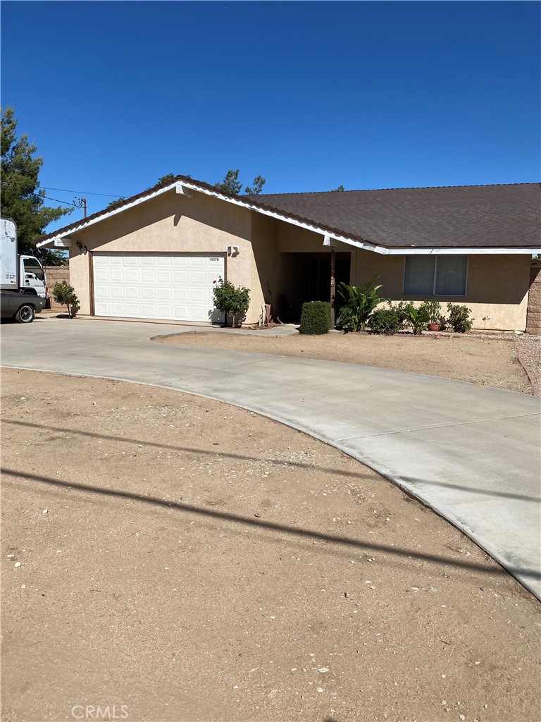Nestled in the serene and spacious The Mesa neighborhood of Hesperia, California, this charming single-family home at 17578 Walnut St offers a perfect blend of comfort, convenience, and desert tranquility. Built in 1981 and thoughtfully remodeled in 2012, this 1,737-square-foot residence sits on a generous 0.46-acre lot, providing ample outdoor space for gardening, recreation, or simply enjoying the peaceful surroundings. With its single-story layout, all three bedrooms are conveniently located downstairs, making it ideal for families, retirees, or anyone seeking easy accessibility without stairs. The home features two full bathrooms, ensuring plenty of room for daily routines.
Inside, the open and inviting floor plan includes a cozy fireplace for those cooler desert evenings and large windows that frame stunning mountain views, bringing the natural beauty of the High Desert right into your living space. The interior boasts a total livable area designed for modern living, with central air conditioning to keep you comfortable during warm summers and other heating options for efficient climate control year-round. The wood-frame construction and other roofing materials add to the home's durable, low-maintenance appeal.
Outside, the expansive lot offers endless possibilities, whether you envision a desert landscape, a backyard oasis, or space for RVs and toys—common in this rural-inspired community. A two-car attached garage provides secure parking and storage, enhancing the property's practicality. Currently occupied by long-term tenants, this home could serve as an excellent primary residence or a solid investment opportunity for rental income in a quiet, peaceful area.