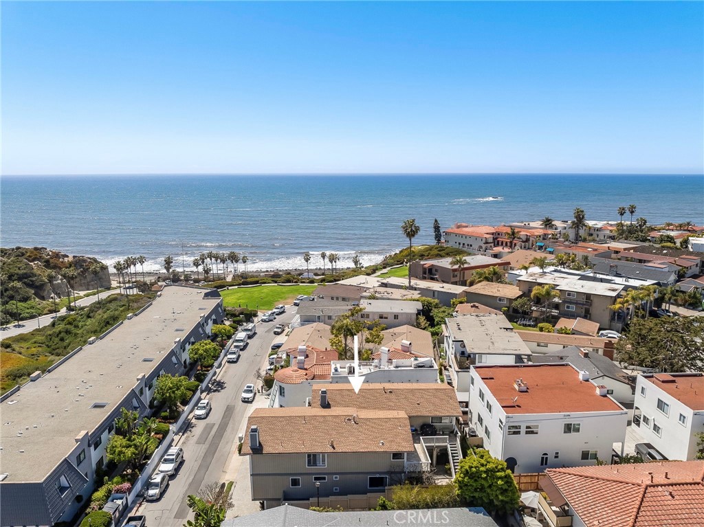 Welcome to your seaside retreat at 236 Avenida Lobeiro, a rare duplex opportunity just four doors from the bluff trail leading to some of San Clemente’s most beloved local beaches. With stunning ocean views and a versatile layout, this property offers a range of living scenarios: live in one unit and rent the other, co-own with family or friends, or invest in a prime coastal income property. Each of the two homes feels like a standalone residence, with three bedrooms, a spacious living area, a two-car garage, and its own private entry. Thoughtful floorplans provide ample room to live, relax, work, and entertain. Vaulted ceilings, fireplaces, and expansive decks create inviting spaces filled with natural light and coastal breezes. Expansive outdoor decks and patios offer the perfect spot to unwind with a view. Residence A is currently leased, offering immediate income potential. Residence B, lovingly held by the property’s original owners, features an impressive bonus space ideal for a home office, gym, or storage, a rare and valuable addition. A large shared laundry room with full bathroom allows a perfect spot to shower off after a day at the beach for convenience. Calafia Beach Park across the street, ensures preserved ocean views and green open space for years to come. Meanwhile, San Clemente’s growing collection of shops and restaurants are just moments away, adding to the home’s appeal as both a tranquil escape and a vibrant hub. Whether you’re seeking a multi-generational setup, a beach-close investment, or a flexible full-time residence, 236 Avenida Lobeiro offers unmatched potential in an unbeatable coastal location.