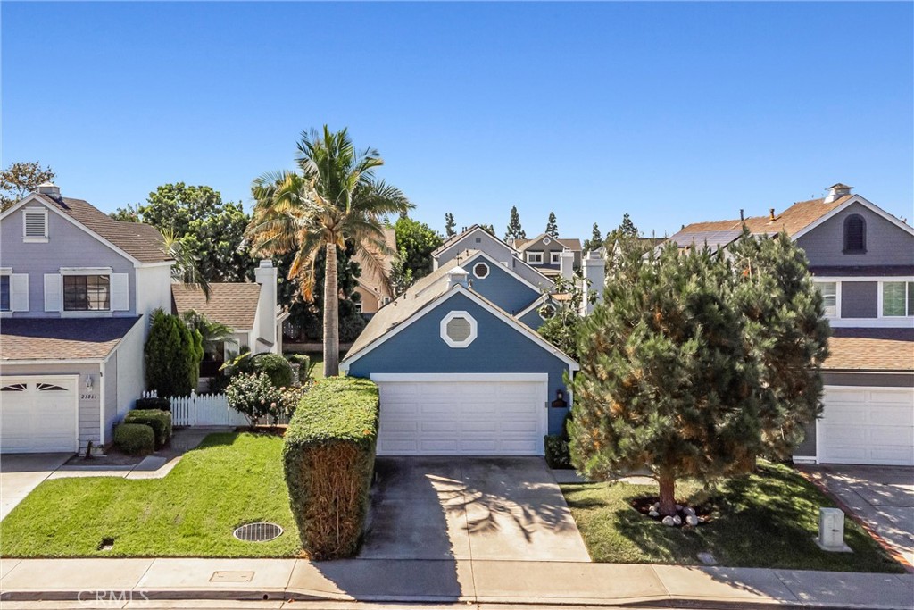Nestled in the highly desirable Evergreen Ridge neighborhood of Mission Viejo, this beautifully remodeled Cape Cod-style single-story home blends timeless charm with sophisticated modern upgrades. With two spacious bedrooms and two renovated bathrooms, this residence offers comfort, functionality, and style. From the moment you arrive, the curb appeal is undeniable, featuring a charming white picket fence, mature landscaping, a lush lawn, and a welcoming front porch that invites you inside. Step through the door and experience a sense of space and light, with soaring vaulted ceilings, recessed lighting, plantation shutters, and newer interior paint throughout. The living room exudes warmth with a cozy fireplace and a picturesque bay window that frames the front yard perfectly. At the heart of the home is a fully remodeled kitchen, showcasing updated fixtures, quartz countertops, a deep farmhouse sink, designer backsplash, custom cabinetry, and a center island. The adjacent dining area opens to a serene and private backyard retreat, where the patio and sanctuary-style side yard create the perfect setting for relaxing or entertaining. The primary suite is a tranquil escape, complete with vaulted ceilings, large windows with garden views, and a spa-inspired ensuite bathroom featuring a dual-sink vanity and custom step-in shower. The secondary bedroom is bright and airy, while the beautifully updated guest bathroom impresses with stunning designer tile and a classic pedestal sink.
Additional highlights include an attached two-car garage with laundry, a private driveway, and a location on a quiet interior street within a well-maintained, pride-of-ownership community. Residents enjoy access to the exclusive amenities of Lake Mission Viejo, including swimming, boating, fishing, and popular summer concerts. With no Mello-Roos, low HOA dues, and a low tax rate, this is not only a stunning home but a smart investment. Close to award-winning schools, top shopping, dining, parks, and major commuter routes, this is Southern California living at its finest. This is the one. Welcome home.