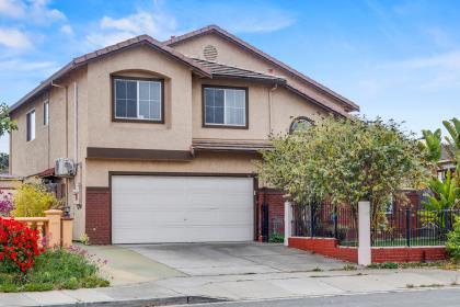 Welcome to this beautiful 5 bedroom, 3 full bath home with over 2600 SF. Live in a comfortable and spacious home. One of the bedrooms and full bath on ground floor. Excellent condition - fresh interior paint, brand new wall-to-wall carpet, laminate flooring in living room and family room. Central forced air heating and electric air conditioning in each bedroom. All existing appliances stay - stove, refrigerator, washer/dryer and water softener. The home has solar panels that will be paid free and clear at close of Escrow.