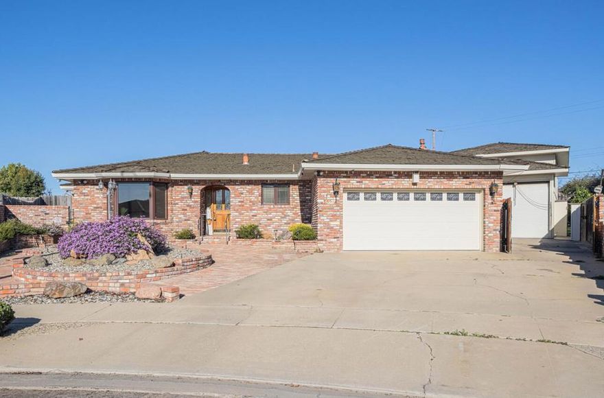 QUARTER OF AN ACRE WITH A HUGE 2 STORY WORKSHOP IN NORTH SALINAS! 4 Bedrooms and 3 FULL Bathrooms..including one extremely big room that can be used for in-law quarters, game room or man cave that also includes a big safe, in which it has its own separate entrance! Primary bedroom has an oversized walk in closet that includes a built in safe...Parking or gated parking for a truck that has tools that need to be locked in for the night! Both family AND Living rooms, Fireplace, new exterior paint throughout, easy maintenance yards including a built in natural gas BBQ pit...beautiful brick home with an oversized driveway in an established neighborhood with an attached 2 car garage. Kitchen features double ovens, dishwasher, a new garbage disposal and refrigerator included. With a substantial living area of 2,782 square feet, this property offers ample space for comfortable living. This home is perfect for entertaining!! Do not miss out on this one!