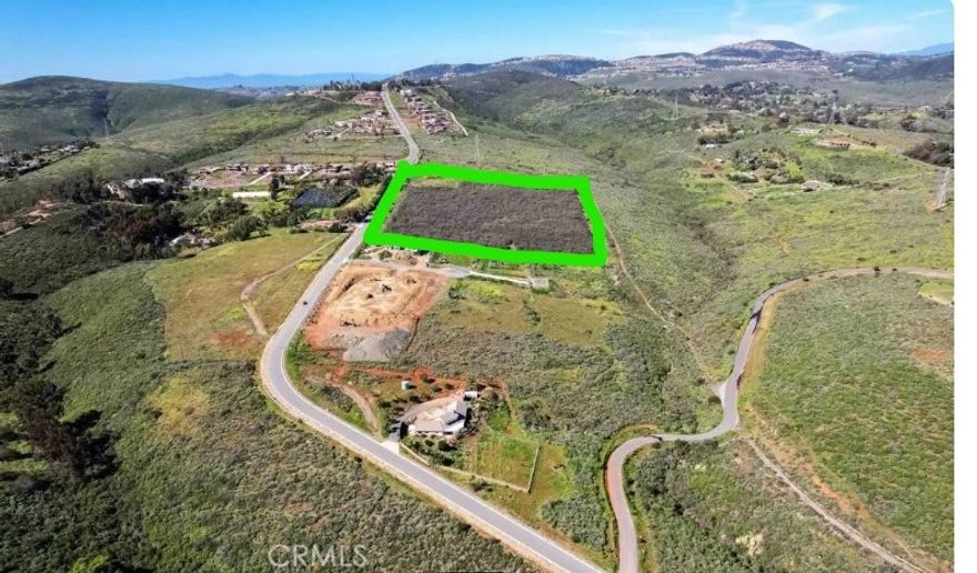 1735 Rancho Summit Dr.  a 9.9- acre flat residential lot presents a rare opportunity in the prestigious Olivenhain Ranch area of Encinitas. This hidden jewel of the prime residential land is available at half the market price, making it ideal for investors or home builders seeking a lucrative venture. The property boasts a panoramic view, nearly all flat terrain, and a picturesque creek at the rear. Positioned in a fast-developing high-end neighborhood with luxury homes featuring amenities like private lakes and horse barns, this parcel is a valuable asset. City utilities are readily accessible, and the land is zoned for two large homes with four acres per residence, in line with the county's preference. Nearby developments have demonstrated strong demand, even with small-sized lots selling for millions. With paved roads, clear boundaries, and a strategic location at 1735 Rancho Summit Dr., Encinitas, this outstanding property in a rapidly appreciating area is a must-see for owner/users for a family compound or large ranch homes or for developers and 1031 exchange buyer for a lucrative investment.