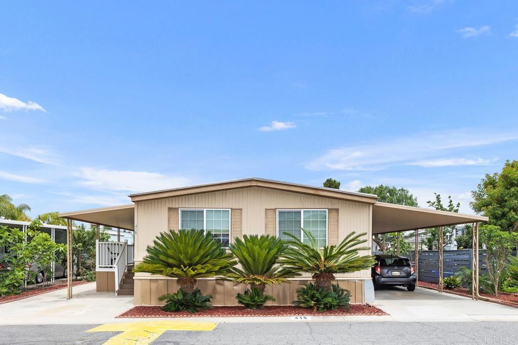 No Property Taxes! Rent Controlled 55+ Community. Space Rent is approx 575.00 a month. Located 4 miles from the beach, this spacious 2 bedroom, 2 bath, 1440 sq ft double wide offers the best of Coastal Living at an unbeatable value. Enjoy an upgraded kitchen, open layout, backyard, and covered patio. Community offers 2 Pools, 2 Clubhouses, and a Pickle ball court. Located close to shopping.