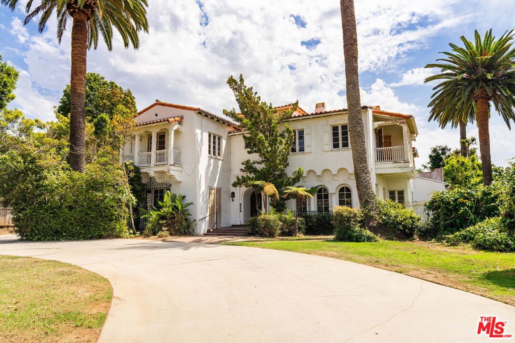 Rare Santa Monica Opportunity - Expansive Lot, Prime Location, Endless Potential! This stately Mediterranean Revival estate presents a once-in-a-generation chance to transform, repurpose, or completely reimagine a classic residence. Just moments from the ocean, this two-story home awaits your vision and design team to bring it into its next chapter. The existing residence offers rich character and timeless details from a bygone era, including stained glass windows, wrought iron accents, painted coffered ceilings, Deco tile, and vintage fixtures. With four bedrooms, four-and-a-half bathrooms, and grand-scale public entertaining rooms, the foundation is set for a remarkable restoration or complete rebuild. Sited on an extraordinary 22,655-square-foot lot with 105 feet of frontage (per public record), the property includes a stately circular driveway, a three-car attached garage, and rear alley access opening the door to creative possibilities such as an ADU, guest house, or expanded garage. Positioned in one of Santa Monica's most prestigious enclaves, the home presents a rare opportunity to create a legacy estate in one of coastal California's most coveted neighborhoods. Enjoy the proximity to the iconic bluffs, pedestrian bridge to the beach, award winning schools, and Montana Avenue's boutique shops, artisanal cafes, and celebrated restaurants. Trust sale.