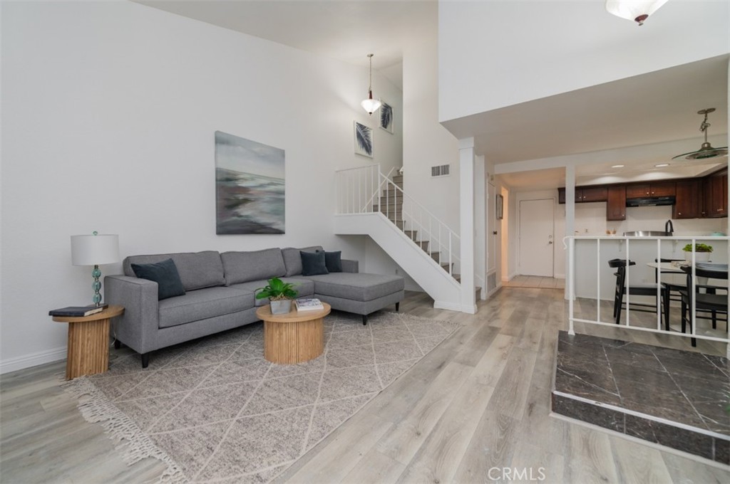 Discover modern comfort and style in this beautifully refreshed 2-bedroom, 2.5-bath townhome nestled in the desirable Park Vista community of Ontario. Offering 1,107 square feet of thoughtfully designed living space, this residence blends bright, contemporary updates with everyday functionality. Step inside to find fresh interior paint throughout, creating a clean and welcoming atmosphere. The vaulted ceiling architecture enhances the home’s airy, open-concept design. The spacious living room features a cozy fireplace and sliding glass doors that open to a private patio overlooking lush greenbelt views—an ideal space for relaxing or entertaining. The kitchen and bathroom cabinets have sleek modern color palette, while recessed lighting adds warmth and brightness. Both bedrooms are upstairs with ensuite bathrooms. The primary suite offers a walk-in closet and full bath, while the secondary bedroom includes a shower and standard closet for convenience. Residents of Park Vista enjoy resort-style amenities, including a sparkling pool, relaxing spa, beautifully maintained landscaping. To easy on the bills, water and trash services are included as well. A two-car attached garage with direct access provides additional convenience and storage. Centrally located near schools, shopping, dining, and major commuter routes, this turnkey townhome offers the perfect balance of comfort, style, and practicality. This upgraded gem is ready to welcome you home in the heart of Ontario.