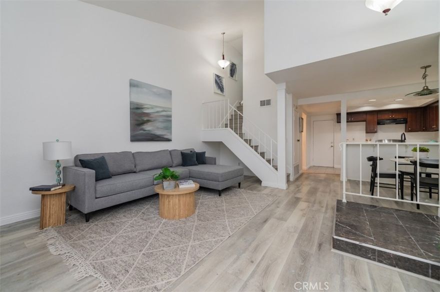 Discover modern comfort and style in this beautifully refreshed 2-bedroom, 2.5-bath townhome nestled in the desirable Park Vista community of Ontario. Offering 1,107 square feet of thoughtfully designed living space, this residence blends bright, contemporary updates with everyday functionality.  Step inside to find fresh interior paint throughout, creating a clean and welcoming atmosphere. The vaulted ceiling architecture enhances the home’s airy, open-concept design. The spacious living room features a cozy fireplace and sliding glass doors that open to a private patio overlooking lush greenbelt views—an ideal space for relaxing or entertaining.  The kitchen and bathroom cabinets have sleek modern color palette, while recessed lighting adds warmth and brightness. Both bedrooms are upstairs with ensuite bathrooms. The primary suite offers a walk-in closet and full bath, while the secondary bedroom includes a shower and standard closet for convenience.  Residents of Park Vista enjoy resort-style amenities, including a sparkling pool, relaxing spa, beautifully maintained landscaping. To easy on the bills, water and trash services are included as well. A two-car attached garage with direct access provides additional convenience and storage.  Centrally located near schools, shopping, dining, and major commuter routes, this turnkey townhome offers the perfect balance of comfort, style, and practicality. This upgraded gem is ready to welcome you home in the heart of Ontario.
