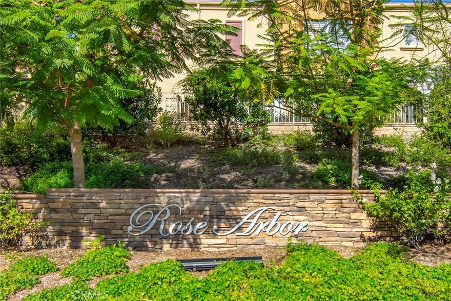 Presenting an ideal end-unit within the sought-after Rose Arbor Condominiums. Come experience piece of mind within this security patrolled community. This prime locale affords the opportunity to savor the surrounding tranquil lush foliage from your large private balcony. Ample windows invite natural light to shine throughout the unit which features a spacious living room with cozy fireplace, smooth ceilings, beautiful flooring and distinct architectural accents. Gorgeous kitchen affords stainless steel appliances, including a refrigerator and plenty of cabinetry. Your primary suite offers access to the balcony, two mirrored wardrobes and a stunning full bath. Desirable direct-access garage comes equipped with a full-size side-by-side washer and dryer. You’re just steps away from a spectacular pool & spa with convenient outdoor shower and restrooms. Take a leisurely stroll, bike ride or go for a run along the adjacent lighted Paseo the area is renowned for. Mere moments to loads of shopping, yummy eateries and easy freeway access. Don’t miss!