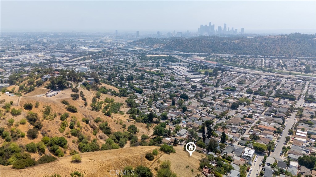 Build Your Mount Washington Dream Home with Unrivaled Views & Urban Convenience. Nestled high in the lush hills of Mount Washington, this rare 9,568 square feet lot zoned LARE20 boasts breathtaking city light and hillside views, with potential for a thoughtfully designed residence. Set on a private paper street, the site provides enhanced privacy, enabling you to create your own driveway and entrance. Just minutes drive from Downtown Los Angeles and Dodger Stadium, this hillside retreat delivers effortless access to the best of the city, whether you're commuting to work or catching the next big game. Step out and enjoy the creative pulse of nearby Highland Park and Eagle Rock, where cozy cafes, shops, and art filled streets await
