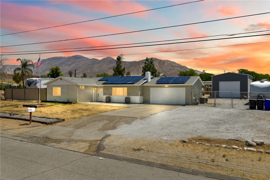Welcome home to the kind of space, comfort, and flexibility that’s hard to find and easy to fall in love with! This charming 3-bedroom, 2-bathroom home sits on a spacious, flat, and fully usable lot, zoned for horses and thoughtfully upgraded for modern living. Whether you’re dreaming of a place to create, relax, entertain, or spread out, this one checks every box and then some.
Step inside and feel instantly at home in the light-filled living space, where a spacious and flowing layout makes everyday living and hosting effortless. The kitchen offers generous counter space, ample storage, and peaceful backyard views; perfect for morning coffee or winding down at the end of the day. All three bedrooms are located just off the hallway, including the primary bedroom which features an attached private bathroom for added comfort and convenience.
But the true magic of this property lies in everything beyond the walls.
Out back, you’ll find a huge insulated patio cover with built-in lighting and ceiling fans; ideal for weekend BBQs, family gatherings, or simply enjoying a quiet evening in the backyard. There’s ample space to garden, play, or even add a poo; and with horse-zoned land, the possibilities are wide open.
One of the standout features is the 22’ x 35’ detached workshop with 14’ walls, 3 fully insulated sides, mini-split A/C, a 100-amp sub-panel, lighting, plenty of outlets, and a ceiling fan; perfect for hobbyists, business owners, or anyone needing a serious workspace.
The home also comes equipped with a solar system, and a 200-amp electrical panel upgrade, helping to reduce energy costs and boost efficiency.
Located just minutes from a brand new shopping center, you’ll love having shops, restaurants, and essentials close by, while still enjoying the serenity and space of country-style living.
This home offers more than just great features, it offers a lifestyle. A place to grow, work, relax, and make memories for years to come. Come see what makes this property truly special!