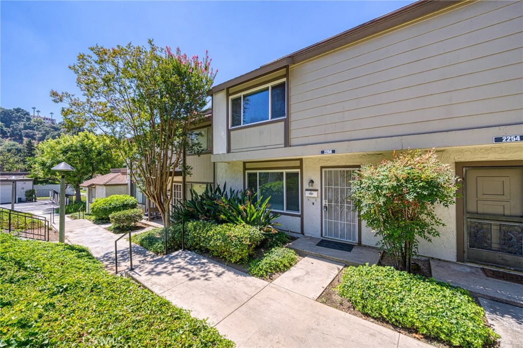 Welcome to this charming and quiet condo featuring 3 bedrooms and 1.5 bathrooms, perfectly located near top-rated schools including Evergreen Elementary, Chaparral Jr. High, and Diamond Bar High School. All bedrooms are conveniently situated upstairs, offering privacy and comfort. The home offers an updated kitchen with upgraded cabinets, stainless steel appliances, and granite countertops. Bathrooms were also refreshed with granite vanities and a modern shower. Dual-pane windows and an upgraded central A/C system ensure efficiency and comfort throughout the year. Step outside to a private patio yard, ideal for relaxing or entertaining, with direct access to a spacious 2-car garage. The community offers additional amenities including a refreshing association swimming pool. Nestled in a peaceful neighborhood with easy access to the 57 and 60 freeways, this home effortlessly combines style, comfort, and convenience.